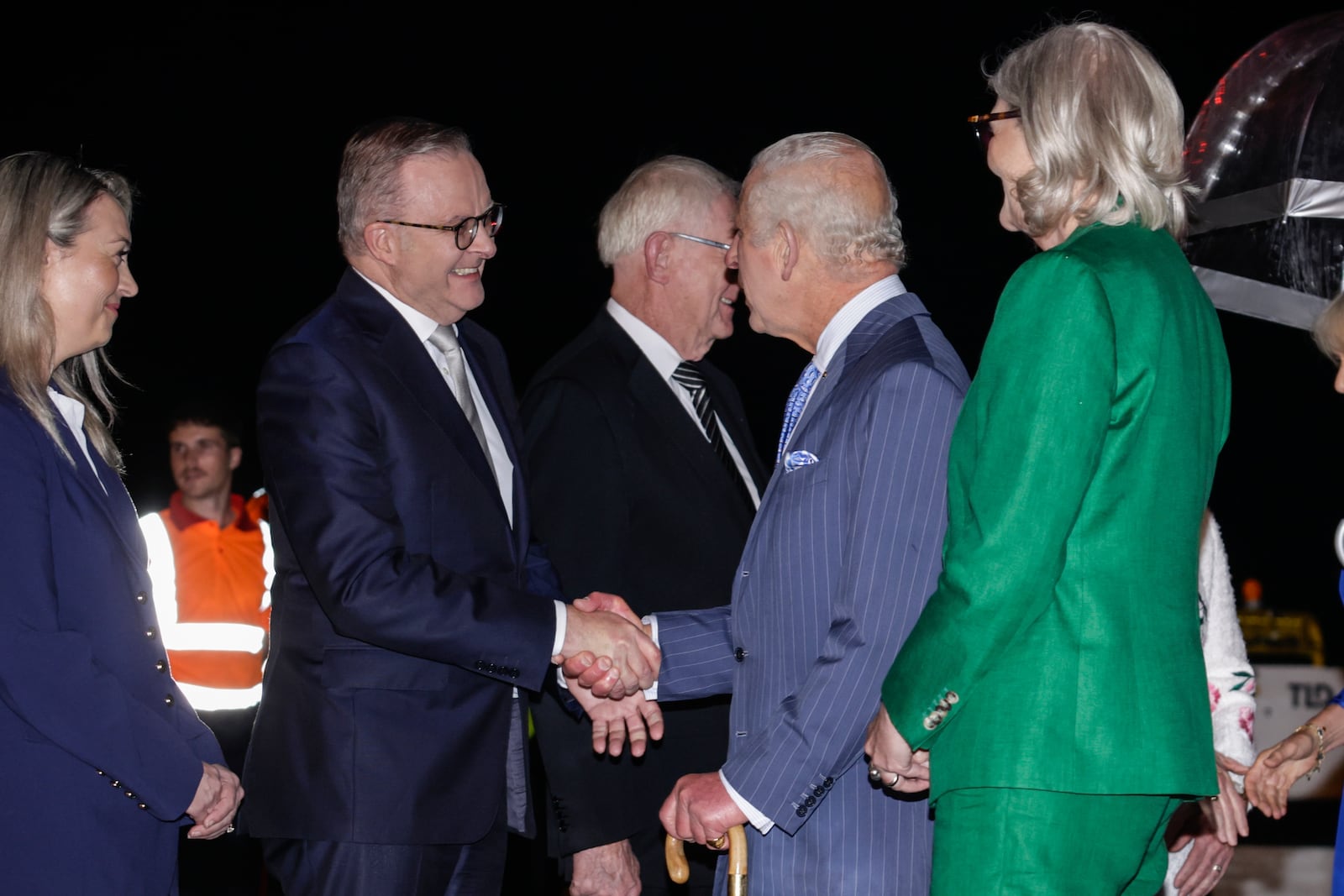 Britain's King Charles shakes hands with Australian Prime Minister Anthony Albanese on his arrival into Sydney for the start of a five-day tour to Australia, Friday, Oct. 18, 2024. (Brook Mitchell/Pool Photo via AP)