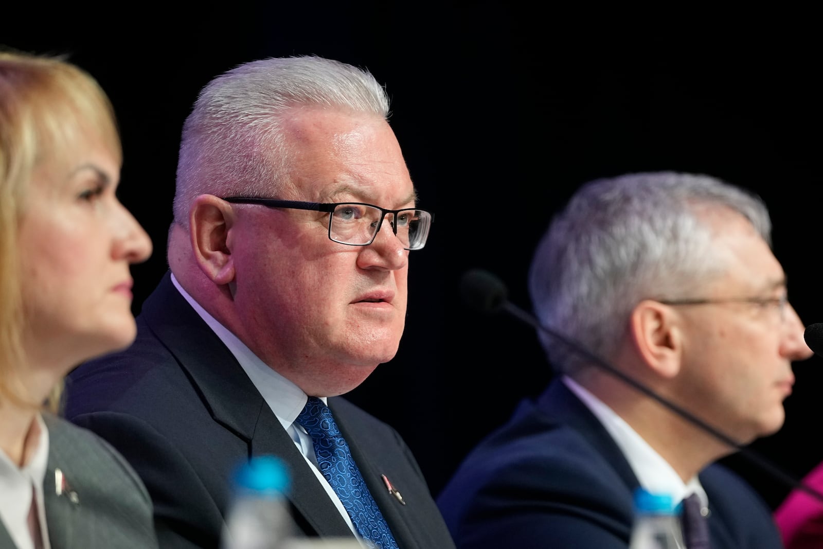 The head of the Central Commission of the Republic of Belarus Igor Karpenko, center, and his colleagues attend a news conference on presidential election results in Minsk, Belarus, Monday, Jan. 27, 2025. (AP Photo/Pavel Bednyakov)