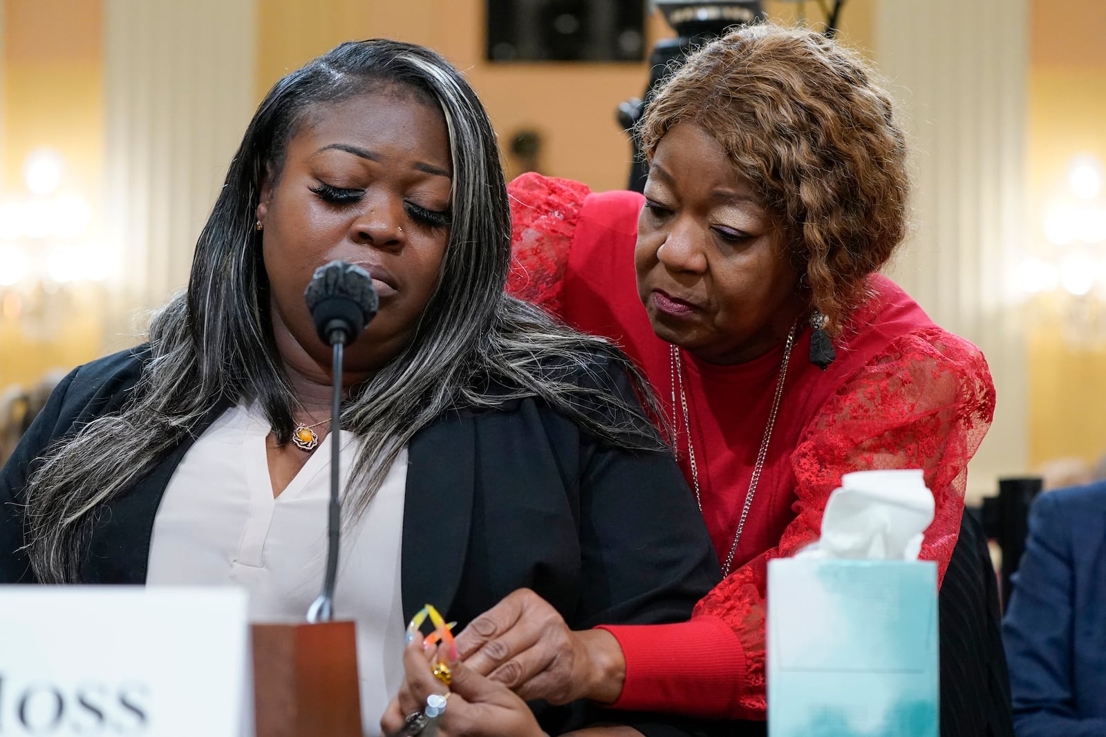 FILE - Wandrea "Shaye" Moss, a former Georgia election worker, is comforted by her mother, Ruby Freeman, right, as the House select committee investigating the Jan. 6 attack on the U.S. Capitol continues to reveal its findings of a year-long investigation, at the Capitol in Washington, June 21, 2022. (AP Photo/Jacquelyn Martin, File)