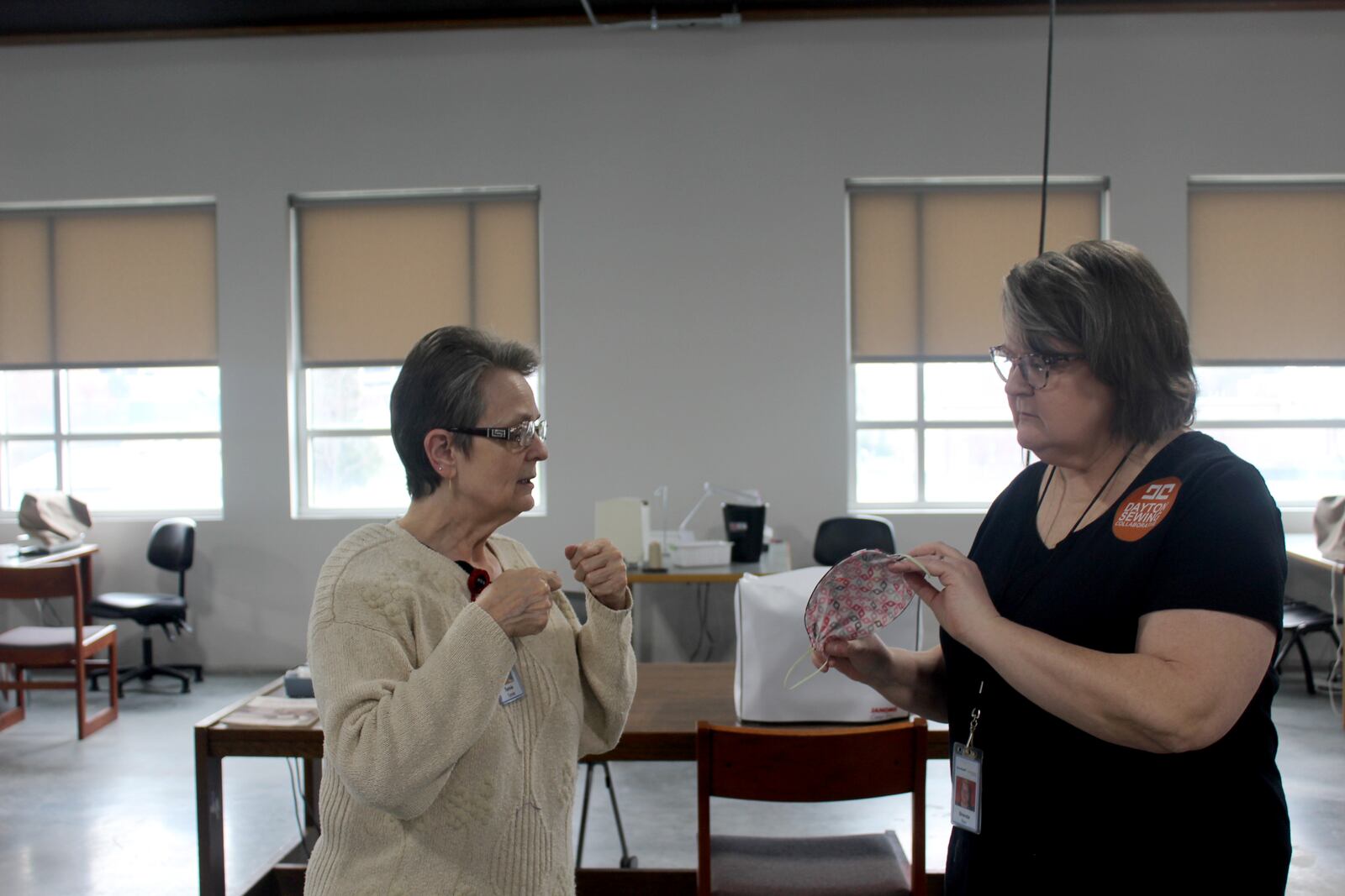 Since Friday, March  20,  Dayton Sewing Collaborative volunteers  in homes around  the community have made hundreds of  reusable face mask for local organization who need them as worries mount of the  coronavirus.   Volunteers Tursia Turner (left)  is pictured with director Brenda Rex.