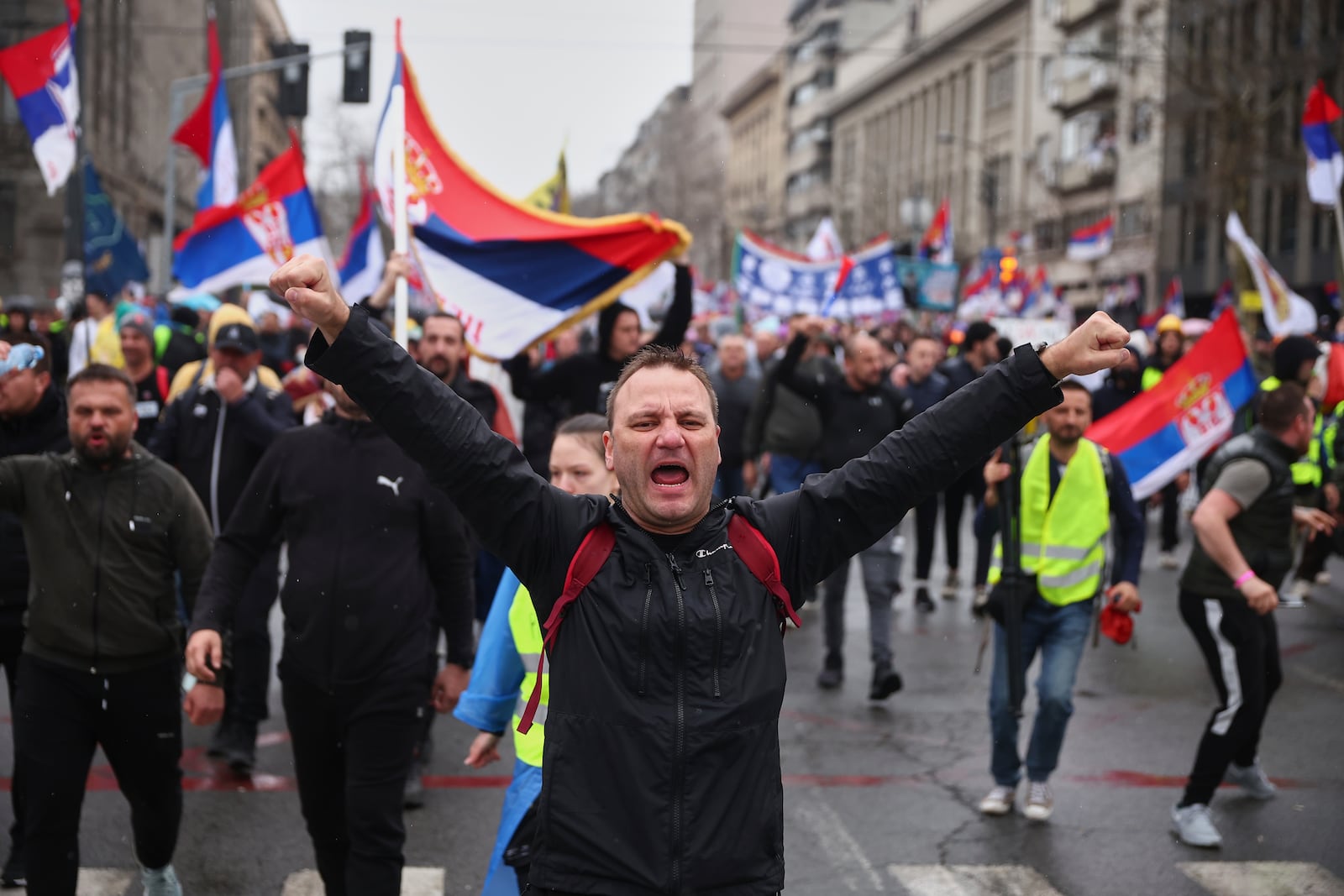 Protesters chant slogans as they march during a major rally against populist President Aleksandar Vucic and his government, in downtown Belgrade, Serbia, Saturday, March 15, 2025. (AP Photo/Armin Durgut)