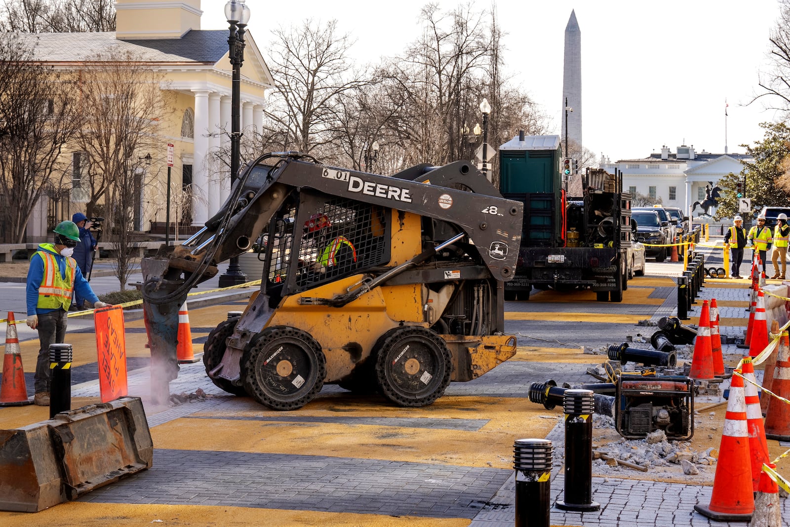 With the White House in the background, demolition begins on the Black Lives Matter mural, Monday, March 10, 2025, in Washington. (AP Photo/Jacquelyn Martin)