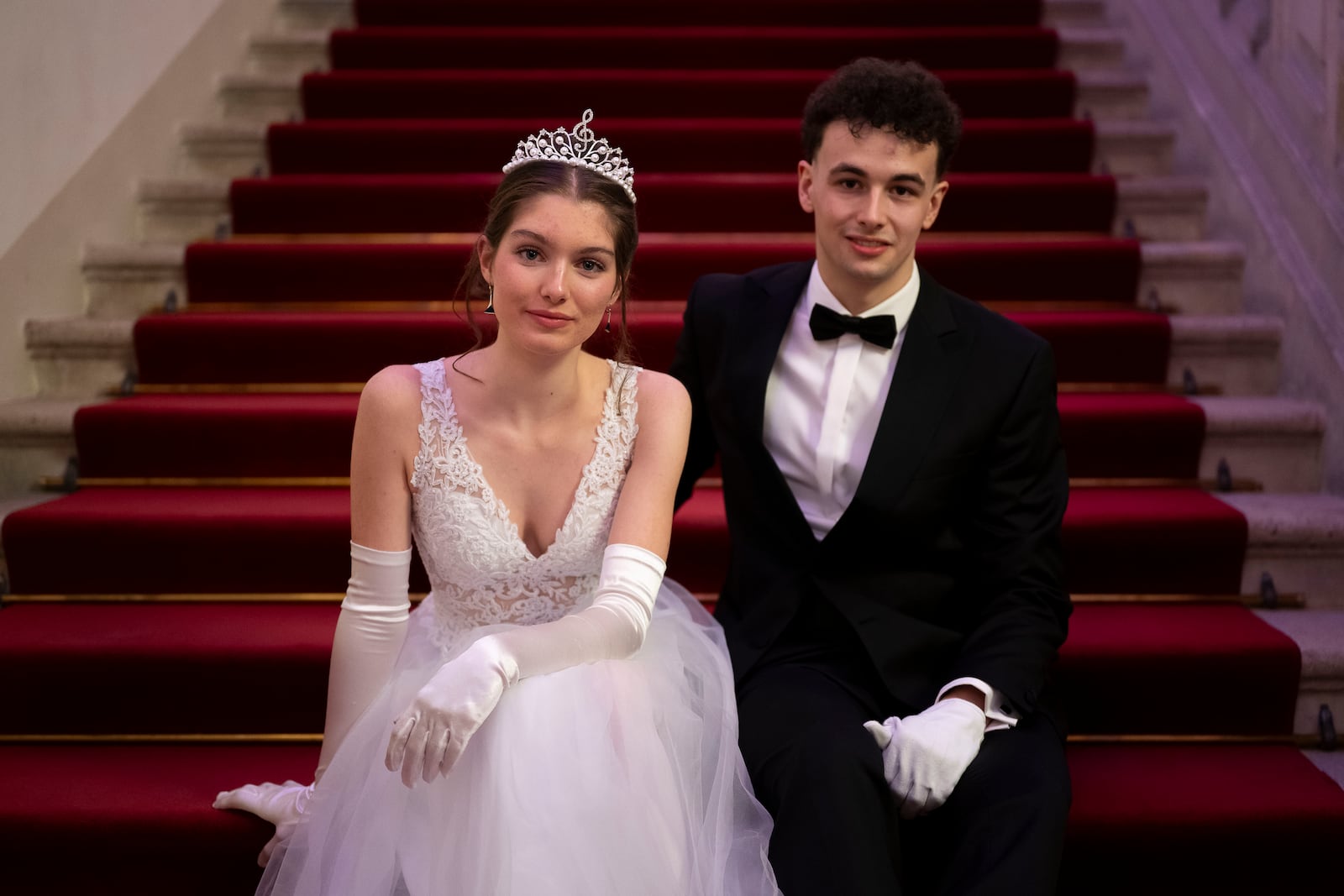 Cornelia Gadermayr, left, and her partner Leander Selmani, right, pose for a photo before the opening ceremony of the Lawyers' Ball in Vienna, Austria, Saturday, March 1, 2025. (AP Photo/Denes Erdos)