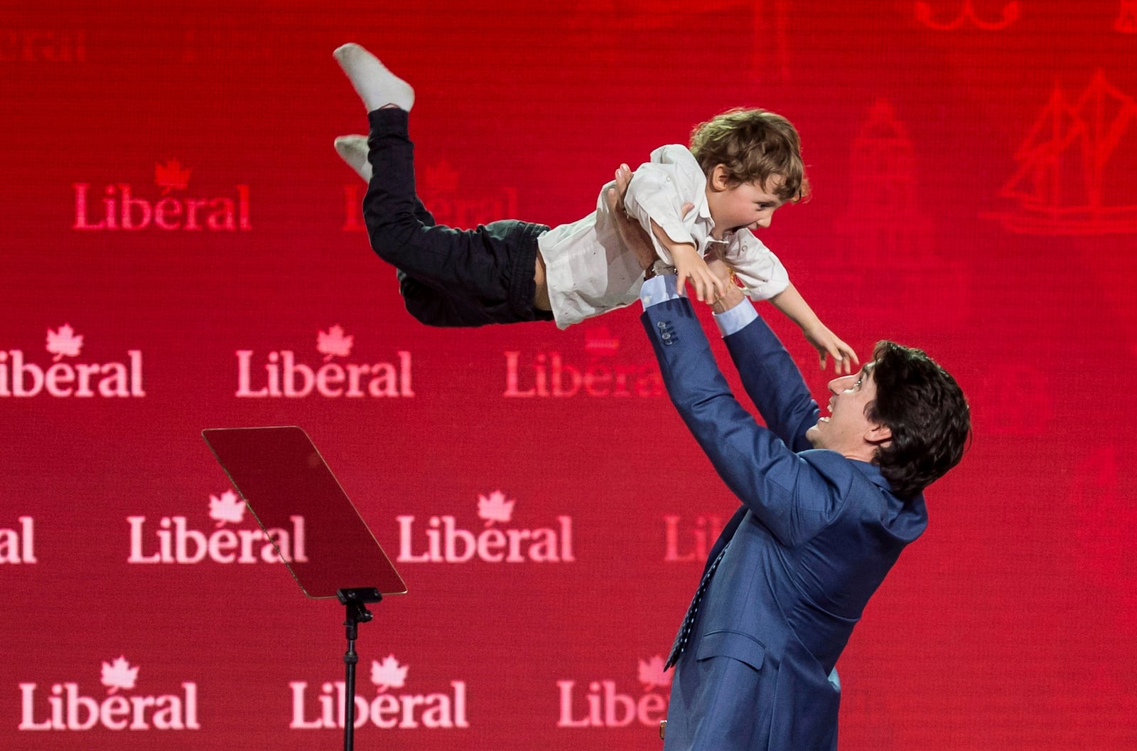 FILE - Prime Minister Justin Trudeau lifts his son Hadrien into the air following his speech at the federal Liberal national convention in Halifax on April 21, 2018. (Darren Calabrese/The Canadian Press via AP, File)