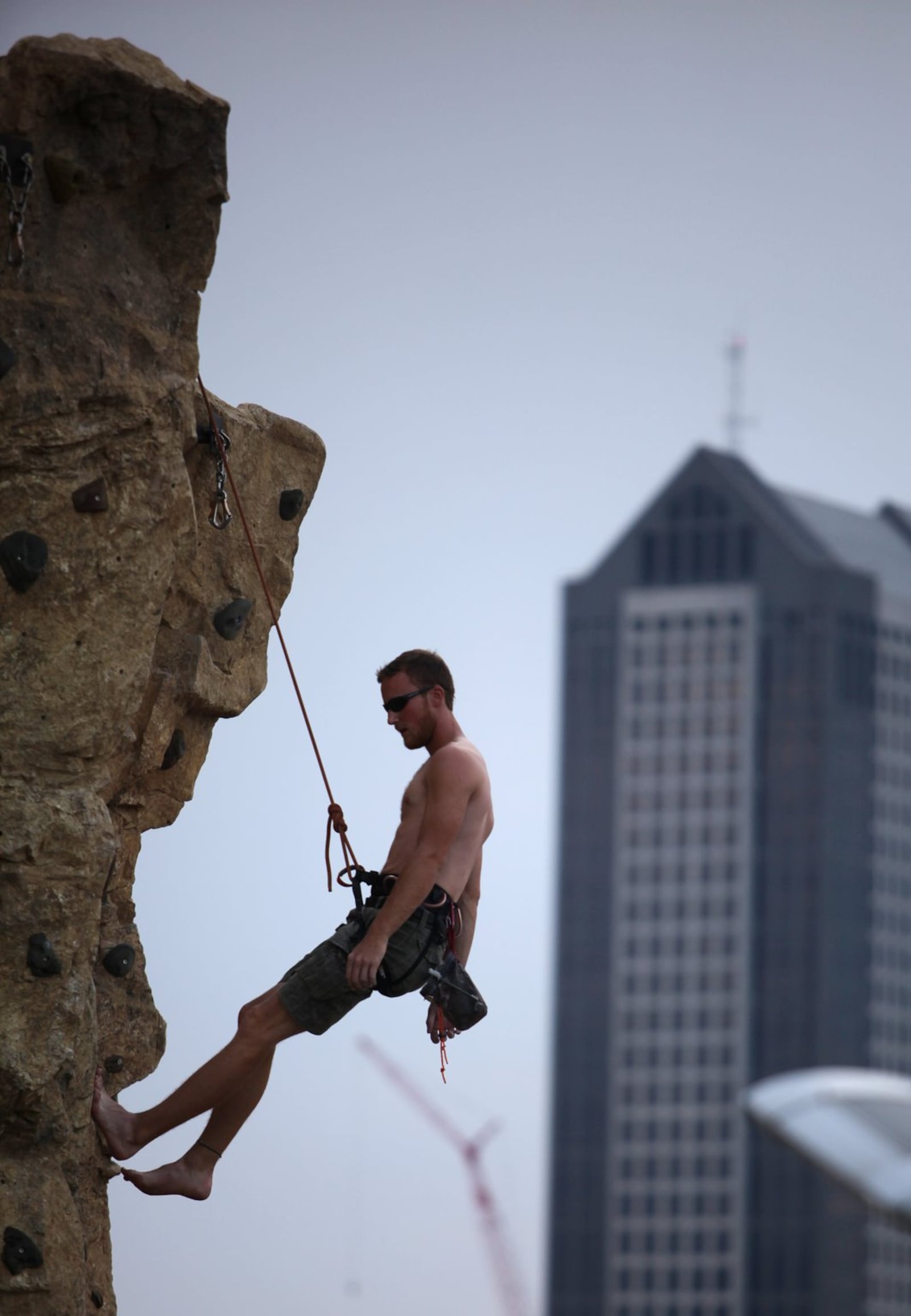 Tyler Miller, 23, of Bexley, descends the climbing wall at the Scioto Audubon Metro Park, Sunday, Aug. 19, 2012. (Dispatch photo by Courtney Hergesheimer)