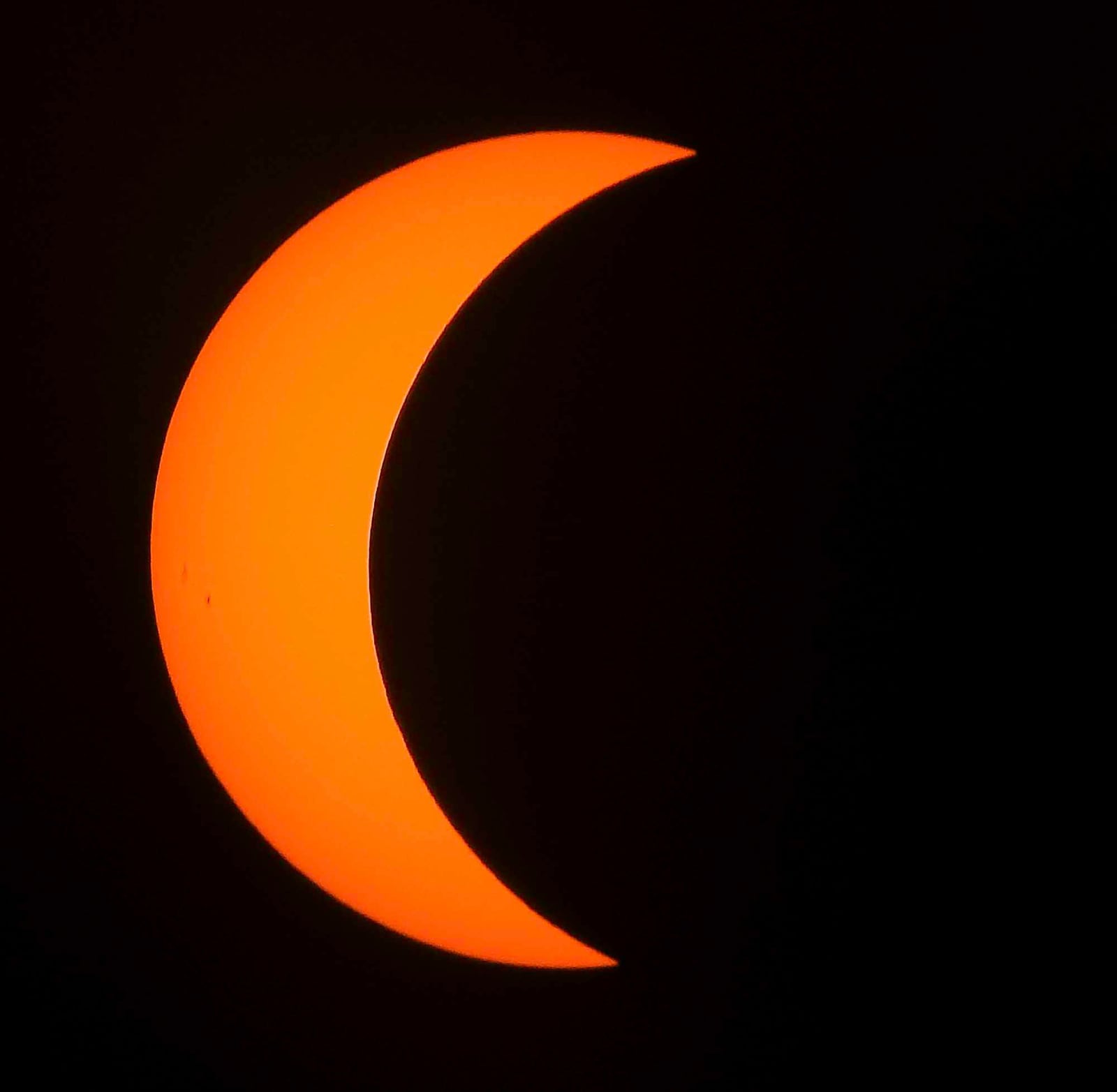 The eclipse was visible through special solar filters and glasses Monday, Aug. 21 in West Chester Township. NICK GRAHAM/STAFF