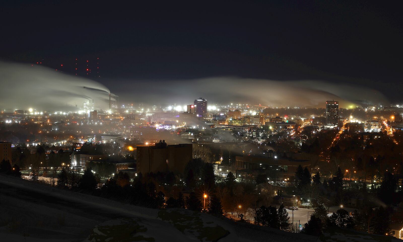 Steam rises from homes and industries in Billings, Mont., as the temperature reaches 21 degrees below zero on Tuesday, Feb. 11, 2025. (Larry Mayer/The Billings Gazette via AP)