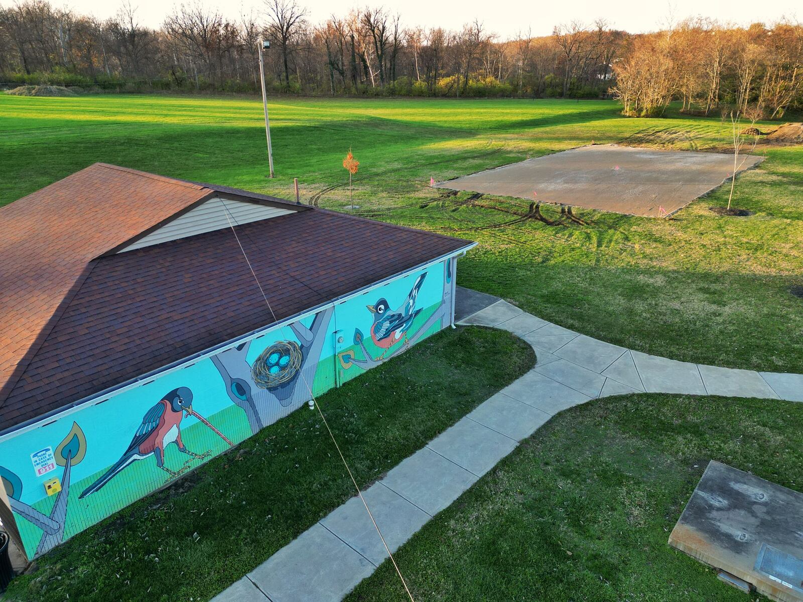 The Hamilton Parks Conservancy District is installing a basketball court at Jim Grimm Park, which is a direct result of four high school students in March 2023 asked City Council for more activities for residents their age. Hamilton worked with the Parks Conservancy District and are addressing those concerns, needs and wants in the community, including this basketball court, which could be ready for use as early as by the end of this year. A gravel base for the court, pictured here in the upper right corner, had been laid before asphalt is poured. NICK GRAHAM/STAFF