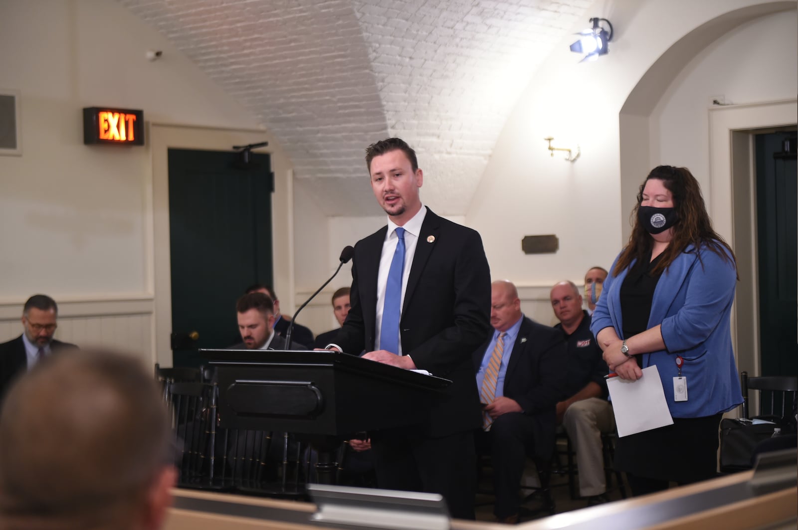 Ohio Rep. Thomas Hall, R-Madison Twp., (at podium) and Ohio Rep. Jessica Miranda, D-Forest Park, (behind Hall) are seeking to pass legislation that would hold railroads accountable for blocking crossings for long periods of time. PROVIDED PHOTO