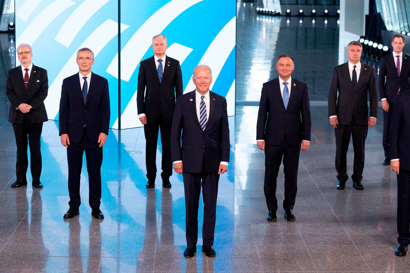 FILE - NATO Secretary General Jens Stoltenberg, second left, and U.S President Joe Biden, center, pose with other leaders during a family picture at the NATO headquarters where the 30-nation alliance hopes to reaffirm its unity and discuss increasingly tense relations with China and Russia, as the organization pulls its troops out after 18 years in Afghanistan, June, 14, 2021. (Jacques Witt, Pool via AP, File)