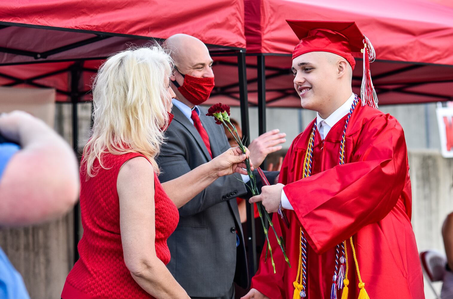 Madison High School drive-thru graduation ceremony at Land of Illusion