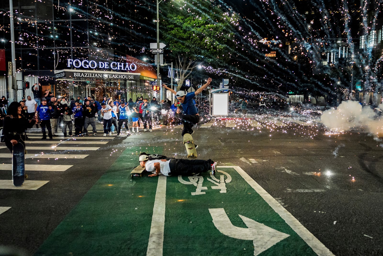 Fireworks go off as fans celebrate on the streets after the Los Angeles Dodgers won against the New York Yankees in the baseball World Series Wednesday, Oct. 30, 2024, in Los Angeles. (AP Photo/Damian Dovarganes)