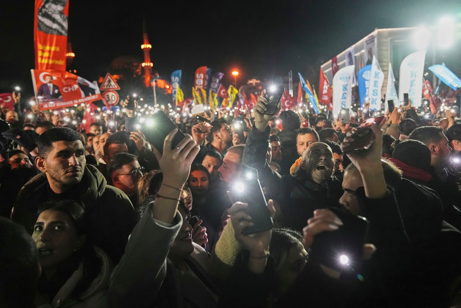 People gather outside the City Hall to protest the arrest of Istanbul Mayor Ekrem Imamoglu in Istanbul, Turkey, Wednesday, March 19, 2025. (AP Photo/Francisco Seco)