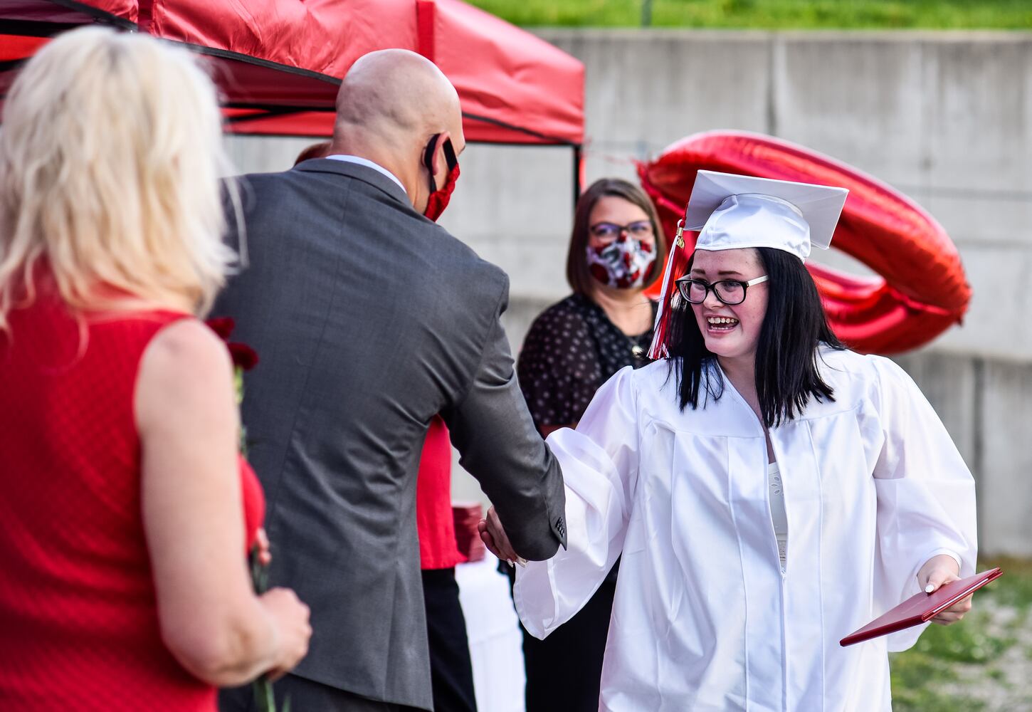 Madison High School drive-thru graduation ceremony at Land of Illusion