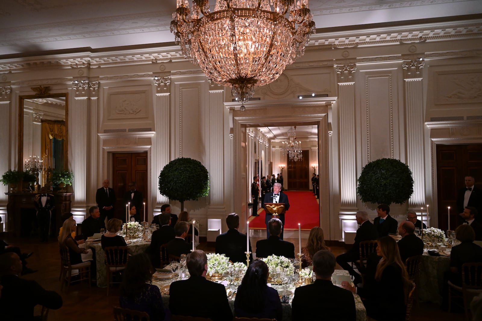 President Donald Trump addresses the National Governors Association dinner and reception in the East Room of the White House Saturday, Feb. 22, 2025, in Washington. (Pool via AP)