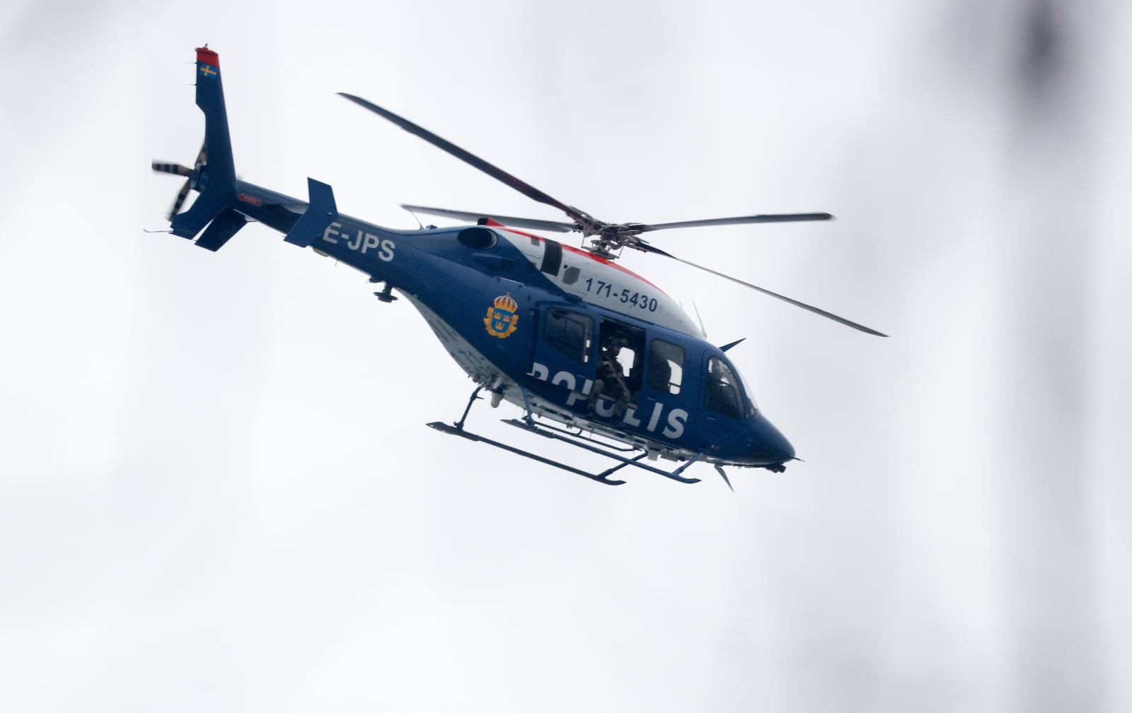 A helicopter at the scene of an incident at Risbergska School, in Örebro, Sweden, Tuesday, Feb. 4, 2025. (Kicki Nilsson/TT News Agency via AP)