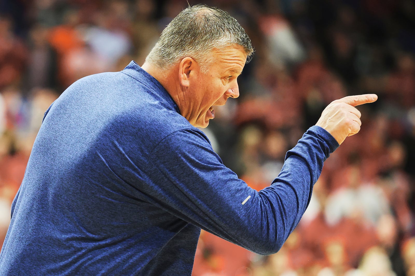 Creighton head coach Greg McDermott shows his displeasure with a call during the first half against Louisville in the first round of the NCAA college basketball tournament in Lexington, Ky., Thursday, March 20, 2022. (AP Photo/James Crisp)