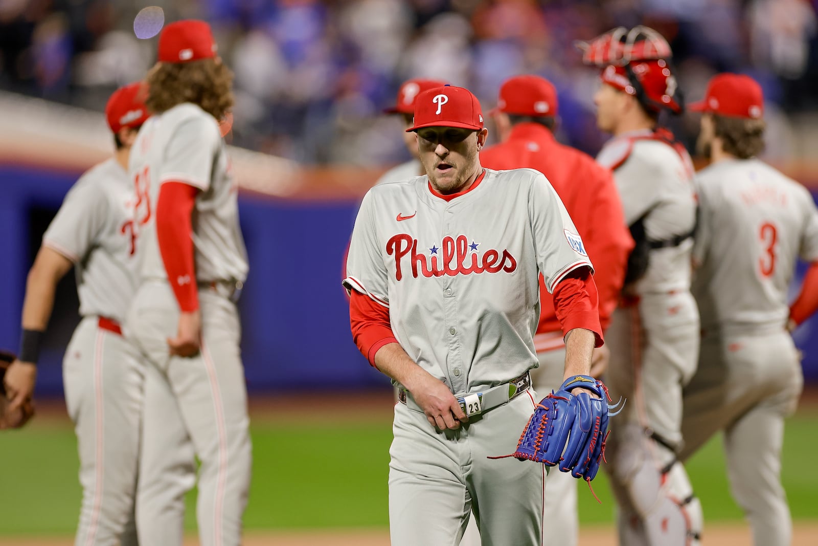 Philadelphia Phillies pitcher Jeff Hoffman walks off the field after walking the bases loaded against the New York Mets during the sixth inning of Game 4 of the National League baseball playoff series, Wednesday, Oct. 9, 2024, in New York. (AP Photo/Adam Hunger)