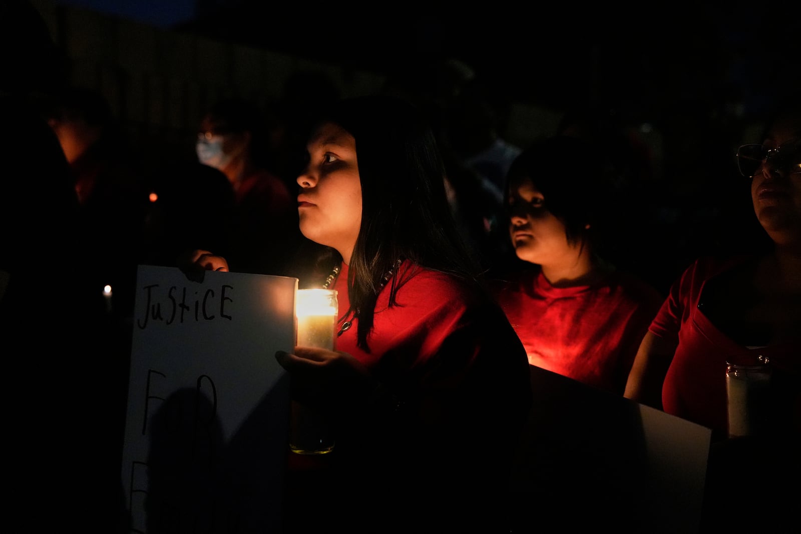 People attend a vigil for slain Native American teen Emily Pike in Mesa, Ariz., Thursday, March 6, 2025. (AP Photo/Samantha Chow)