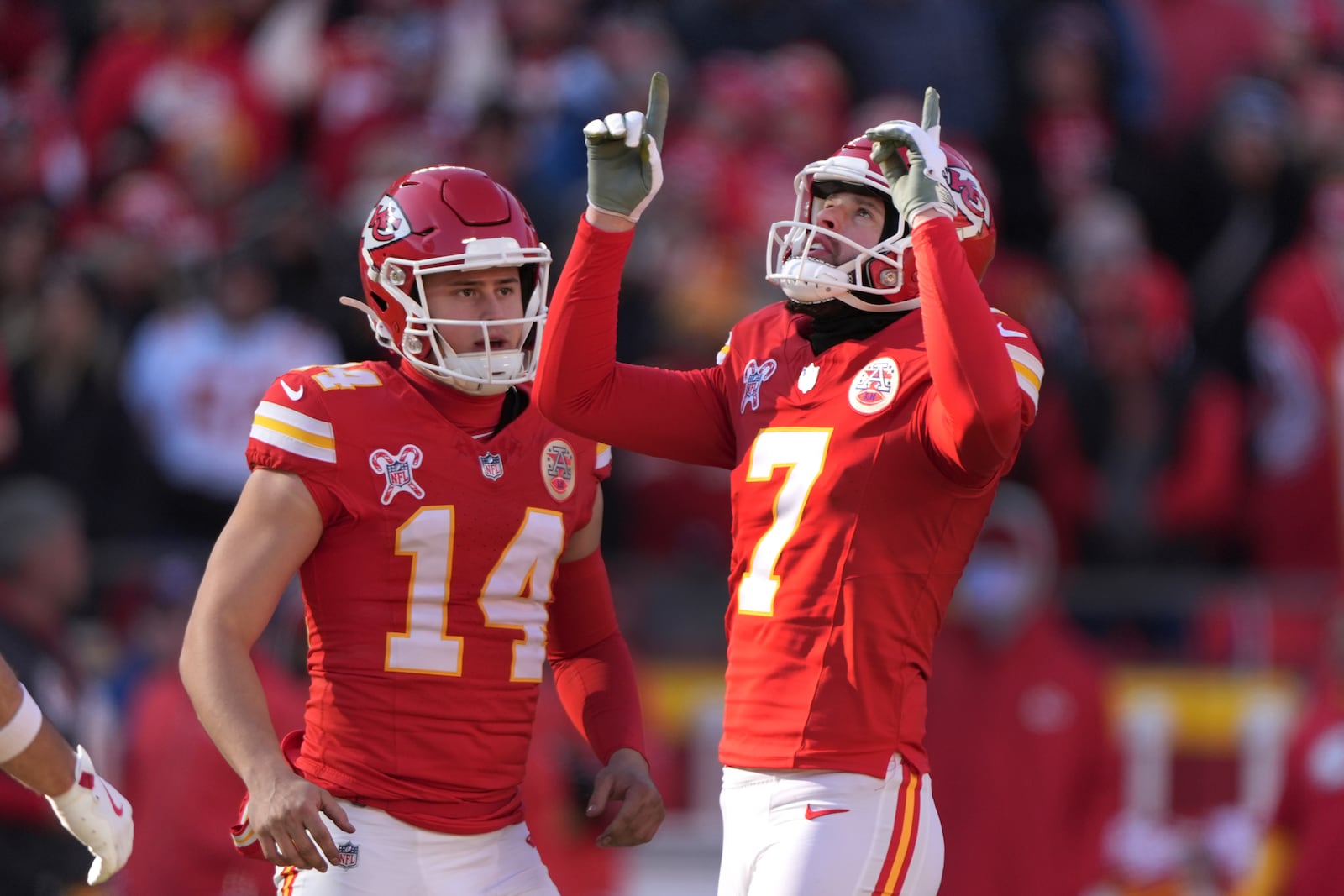 Kansas City Chiefs kicker Harrison Butker (7) celebrates his 44-yard field goal as teammate Matt Araiza (14) watches during the first half of an NFL football game against the Houston Texans Saturday, Dec. 21, 2024, in Kansas City, Mo. (AP Photo/Charlie Riedel)