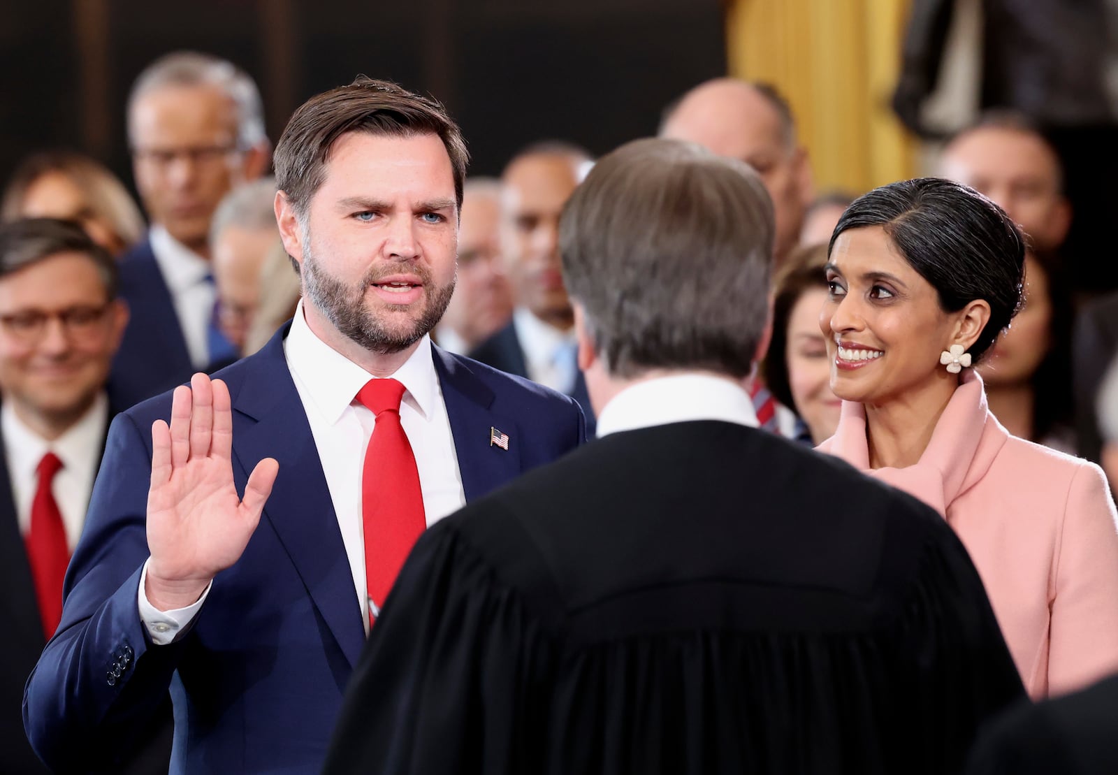 Vice President-elect J.D. Vance, left, takes oath as his wife Usha Vance watches during the 60th Presidential Inauguration in the Rotunda of the U.S. Capitol in Washington, Monday, Jan. 20, 2025. (Kevin Lamarque/Pool Photo via AP)