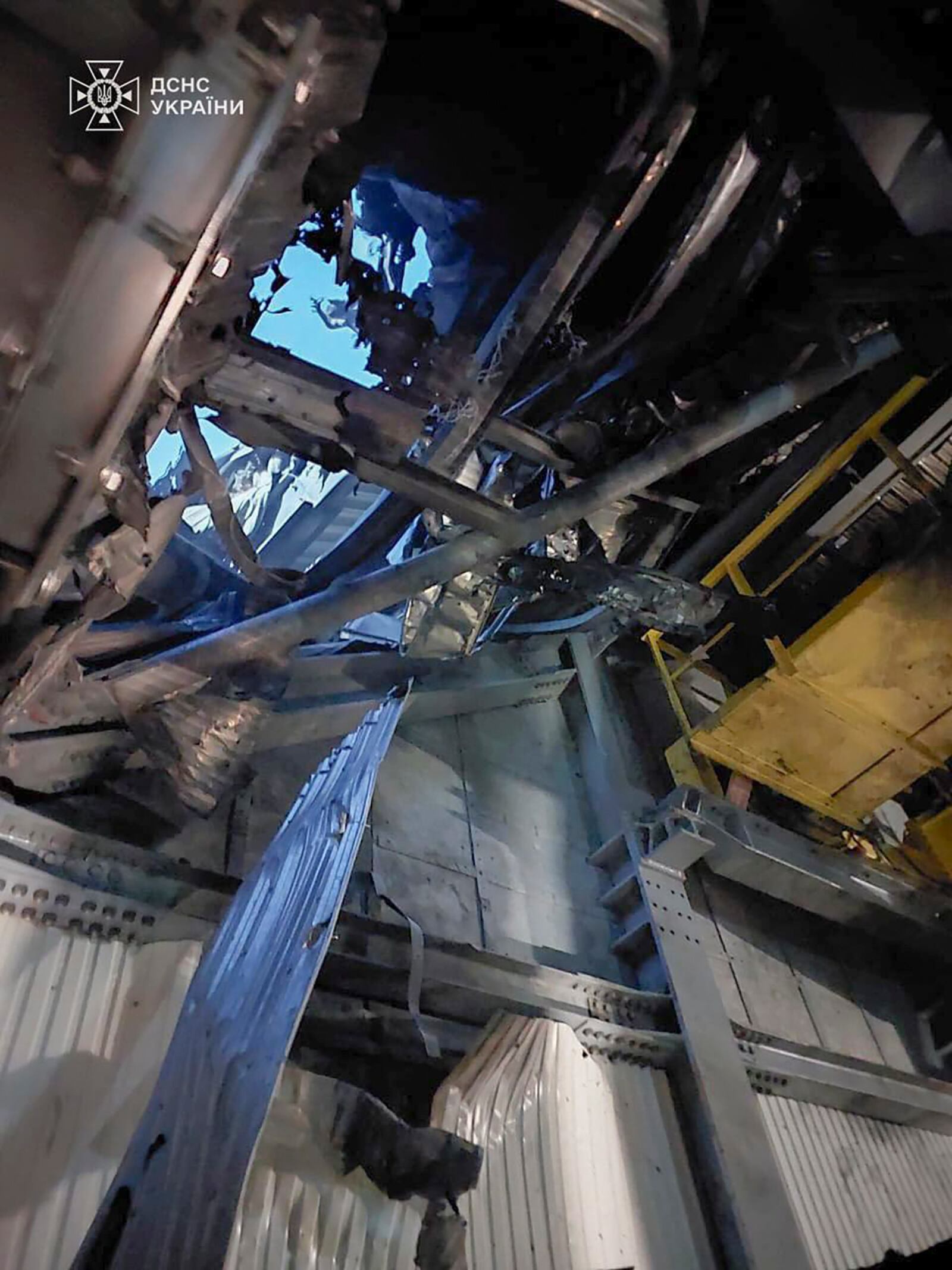 In this photo provided by the Ukrainian Emergency Service, damaged sarcophagus that covers the destroyed 4th reactor of Chernobyl nuclear power plant is seen from inside following a Russian drone attack in Chernobyl, Ukraine, Friday, Feb. 14, 2025. (Ukrainian Emergency Service via AP)