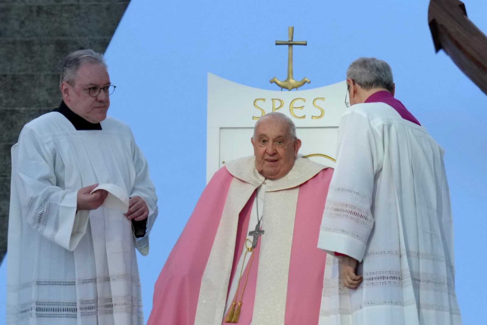 Pope Francis sits during a mass Sunday, Dec. 15, 2024 in Ajaccio, Corsica island, as his one-day visit to Corsica puts a dual focus on the Mediterranean, highlighting local traditions of popular piety on the one hand and migrant deaths and wars on the other. (AP Photo/Thibault Camus)