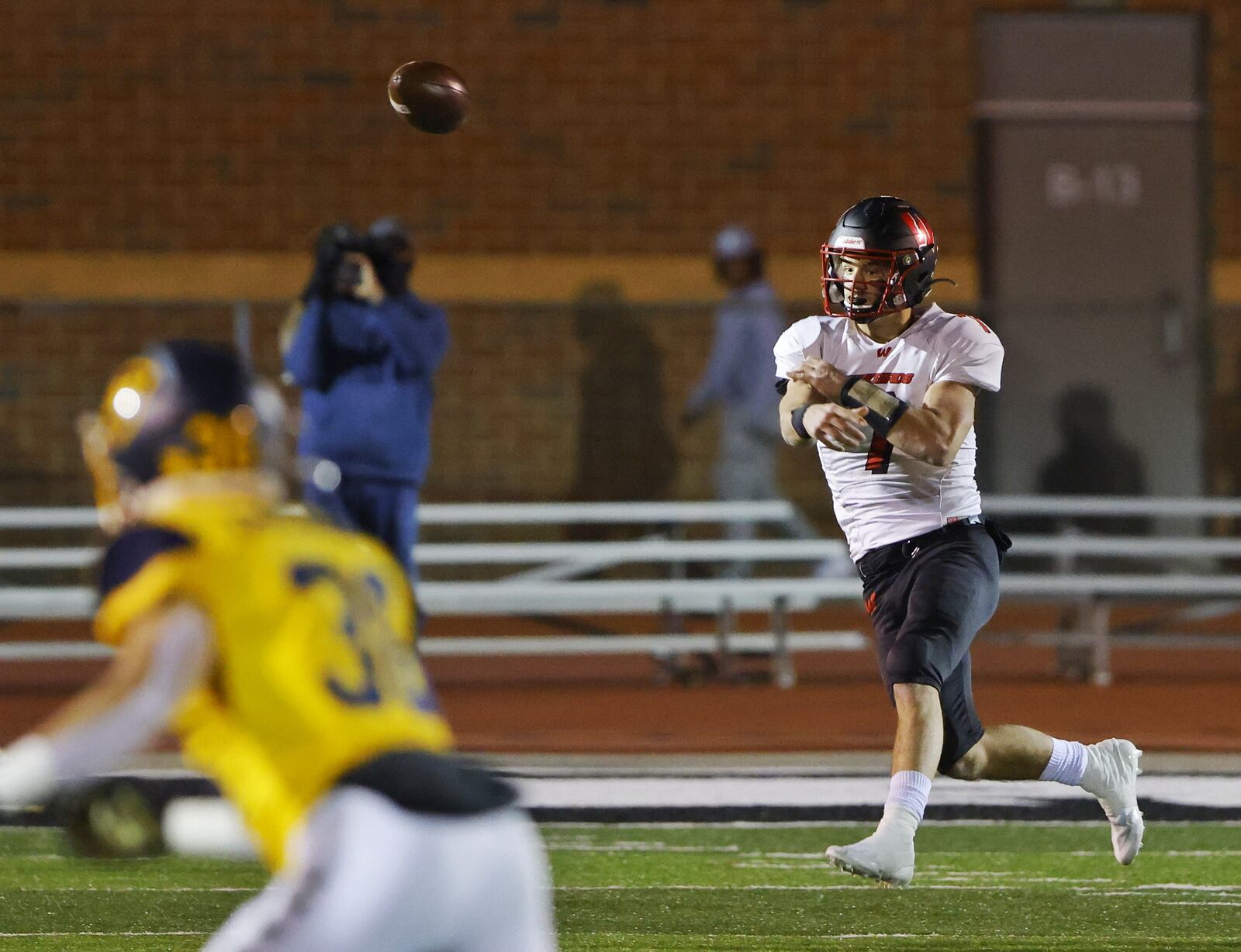 Lakota West quarterback Mitch Bolden throws the ball during their Division 1 playoff football game against Moeller Friday, Nov. 19, 2021 at Dwire Field at Atrium Stadium in Mason. NICK GRAHAM / STAFF