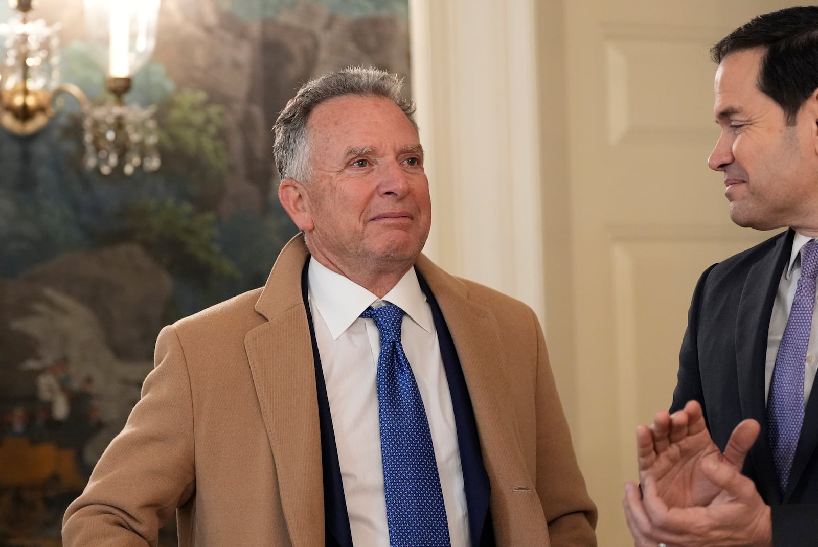 White House national security adviser Mike Walz watches as Secretary of State Marco Rubio applauds as President Donald Trump, accompanied by Marc Fogel, speak in the Diplomatic Reception Room at the White House, Tuesday, Feb. 11, 2025, in Washington. (Photo/Alex Brandon)