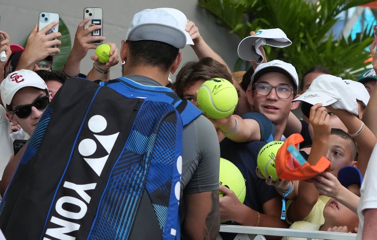 Nick Kyrgios, of Australia, signs autographs after defeating Mackenzie McDonald during the Miami Open tennis tournament, Wednesday, March 19, 2025, in Miami Gardens, Fla. (AP Photo/Lynne Sladky)