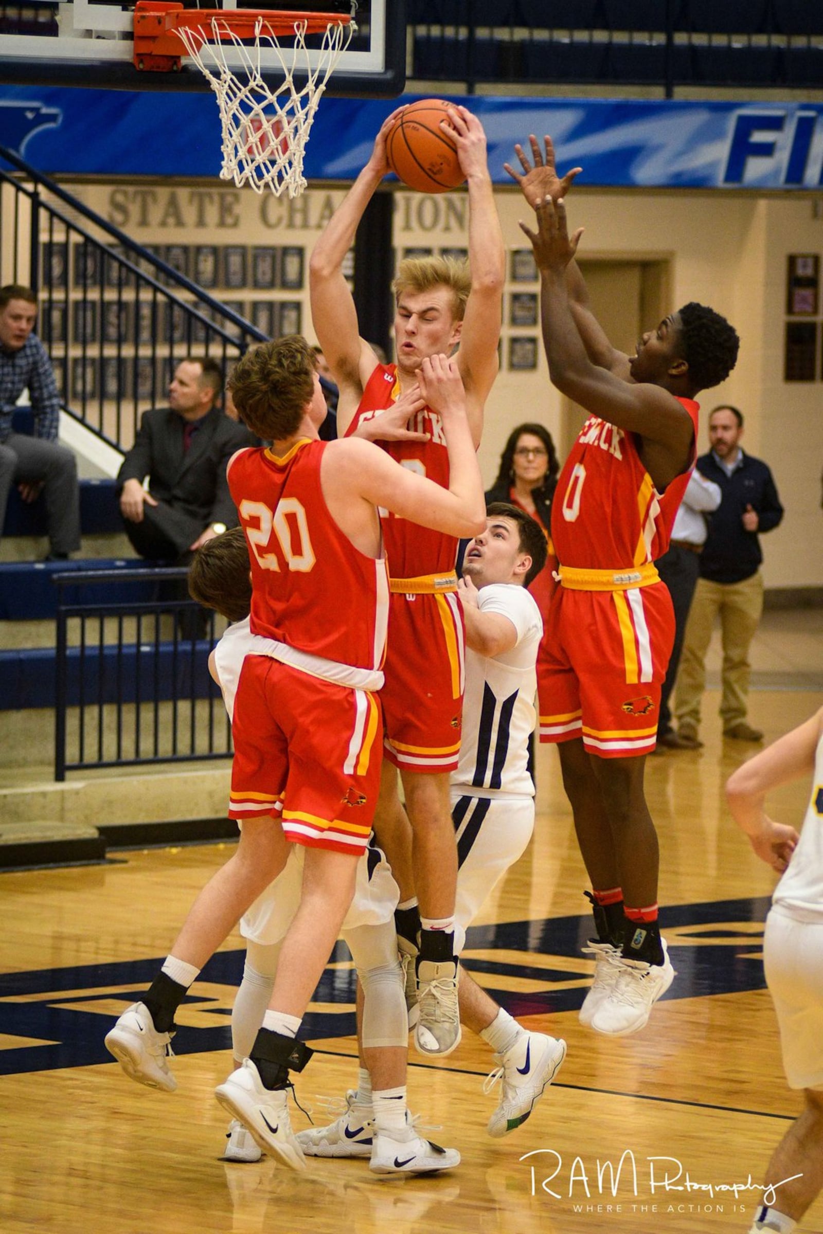 Fenwick’s C.J. Napier grabs a rebound in traffic during Wednesday night’s Division II sectional basketball game against Monroe at Fairmont’s Trent Arena. Fenwick won 60-39. ROB MCCULLEY/RAM PHOTOGRAPHY