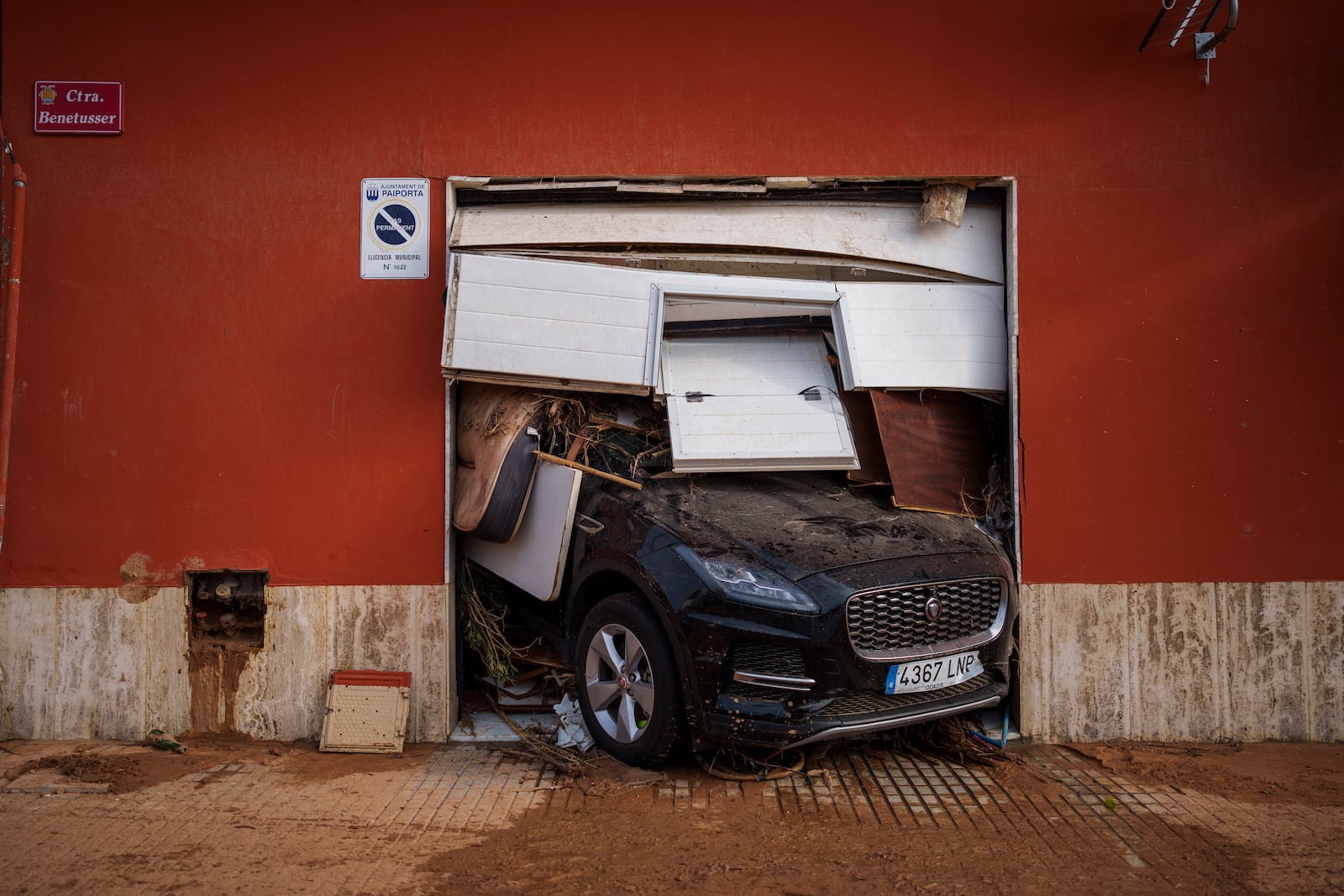 The entrance of a garage in an area affected by the floods is pictured in Valencia, Spain, Saturday, Nov. 2, 2024. (AP Photo/Manu Fernandez)