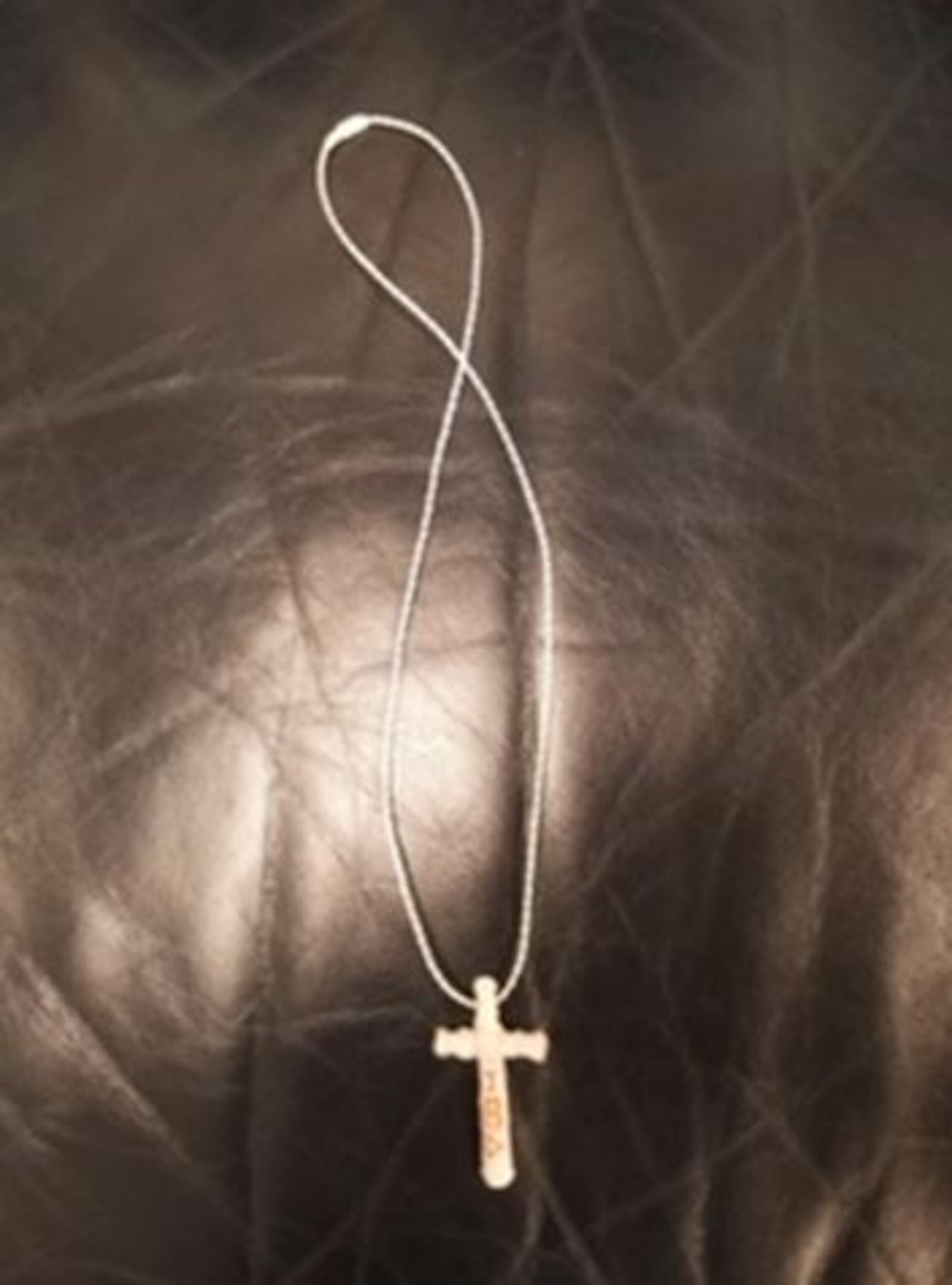 A cross necklace made by a Butler County Jail inmate that was confiscated a contraband BUTLER COUNTY SHERIFF'S OFFICE