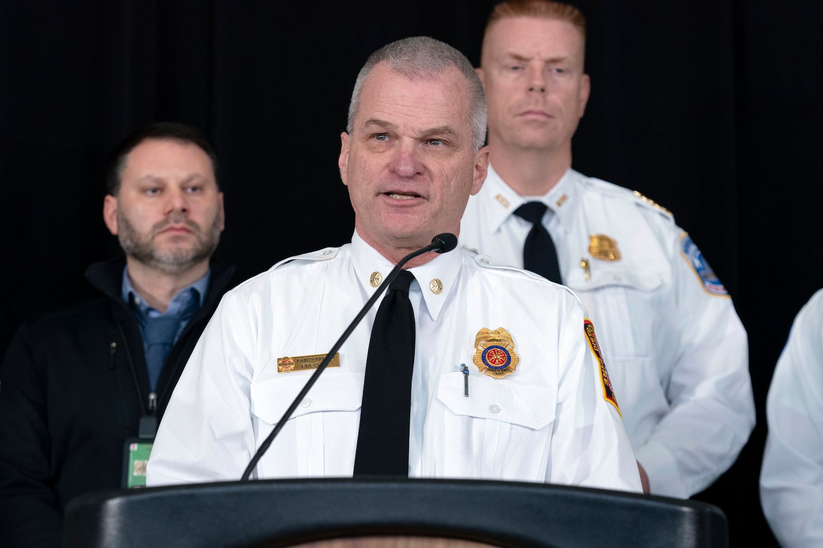 D.C. Fire and EMS Chief John Donnelly speaks during a news conference at Ronald Reagan Washington National Airport, Sunday, Feb. 2, 2025, in Arlington, Va. (AP Photo/Jose Luis Magana)