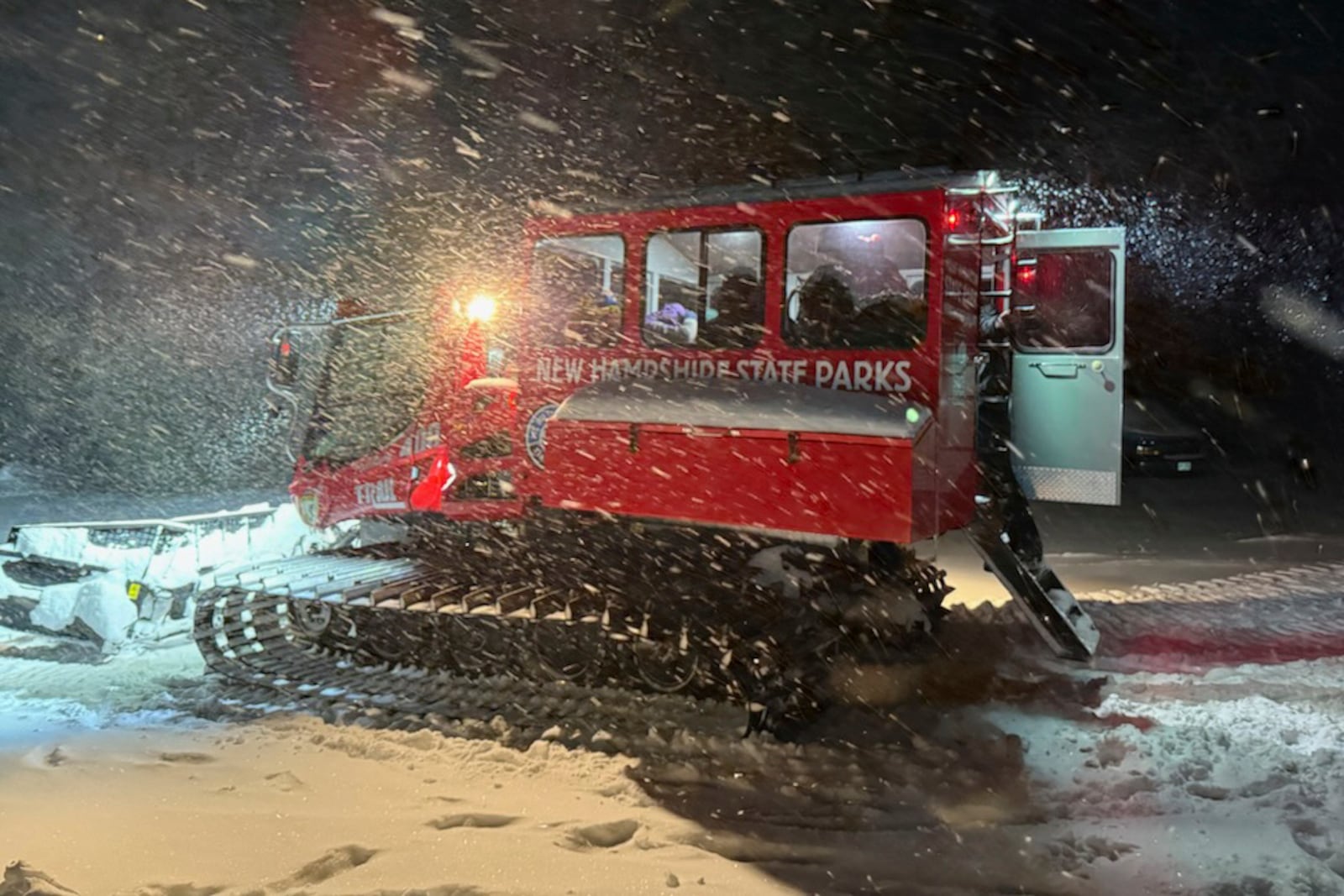 This image provided by the New Hampshire Fish and Game Department shows a snow cat heading out on a rescue mission, on Mount Washington, N.H., Sunday, Feb. 2, 2025. (New Hampshire Fish and Game Department photo via AP)