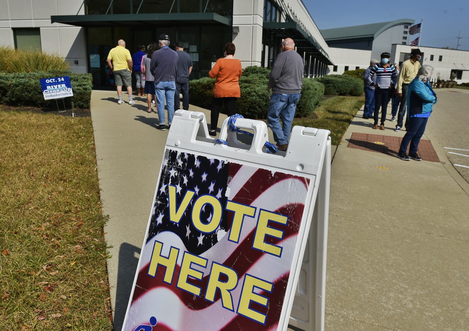 Voters line up at the Butler County Board of Elections on the first day of early voting Tuesday, October 6, 2020 in Hamilton. NICK GRAHAM / STAFF