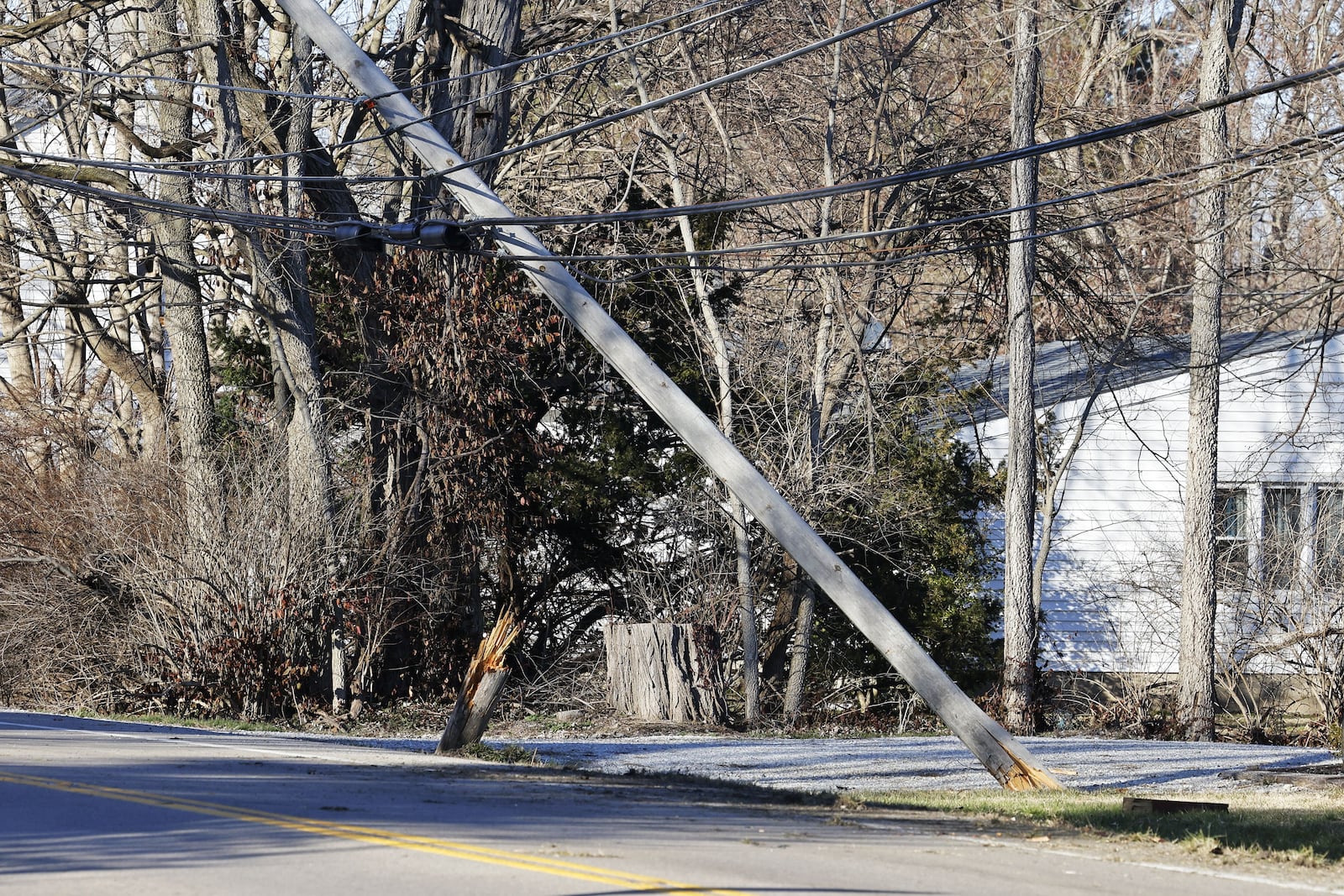 A utility pole was knocked over Monday when a driver lost control of his vehicle on Ohio 177. NICK GRAHAM/STAFF