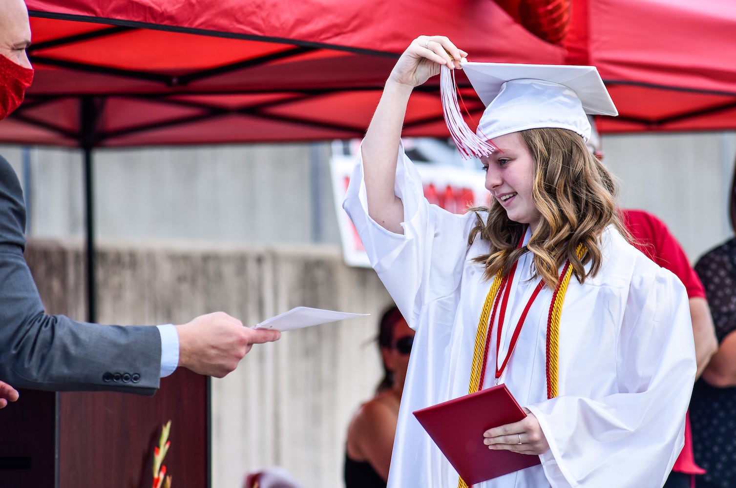 Madison High School drive-thru graduation ceremony at Land of Illusion