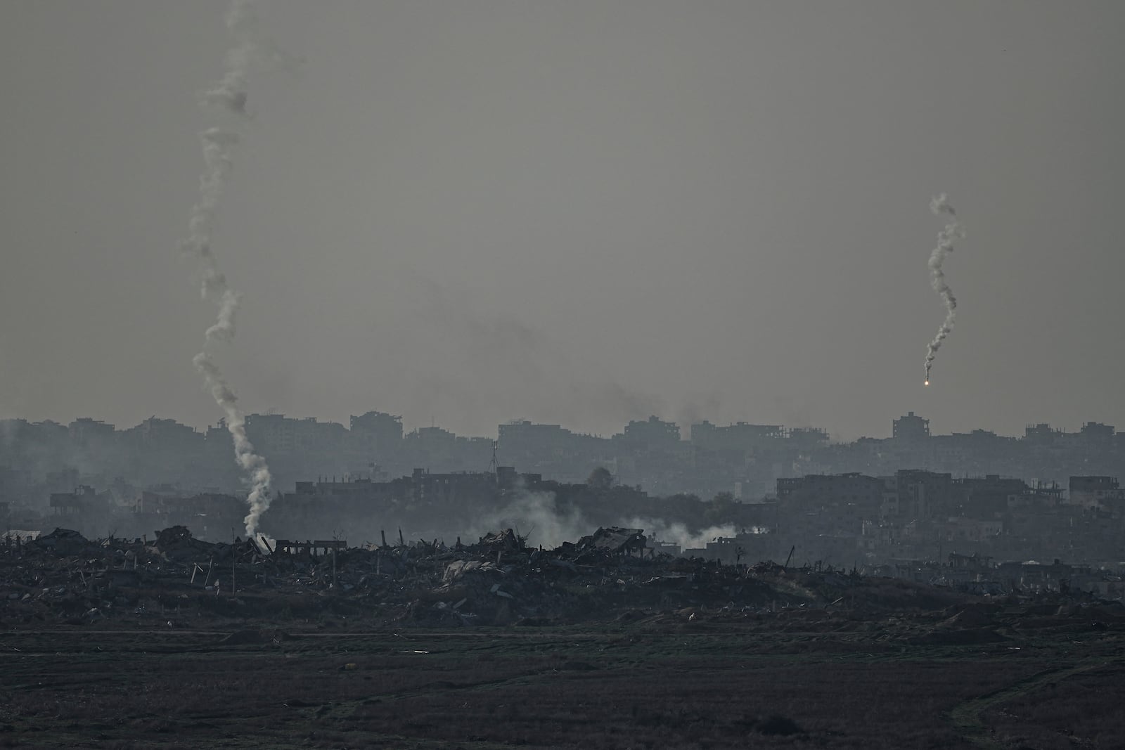 An Israeli army flare is seen over the Gaza Strip, as seen from Sderot, southern Israel, Monday, Jan. 6, 2025. (AP Photo/Tsafrir Abayov)