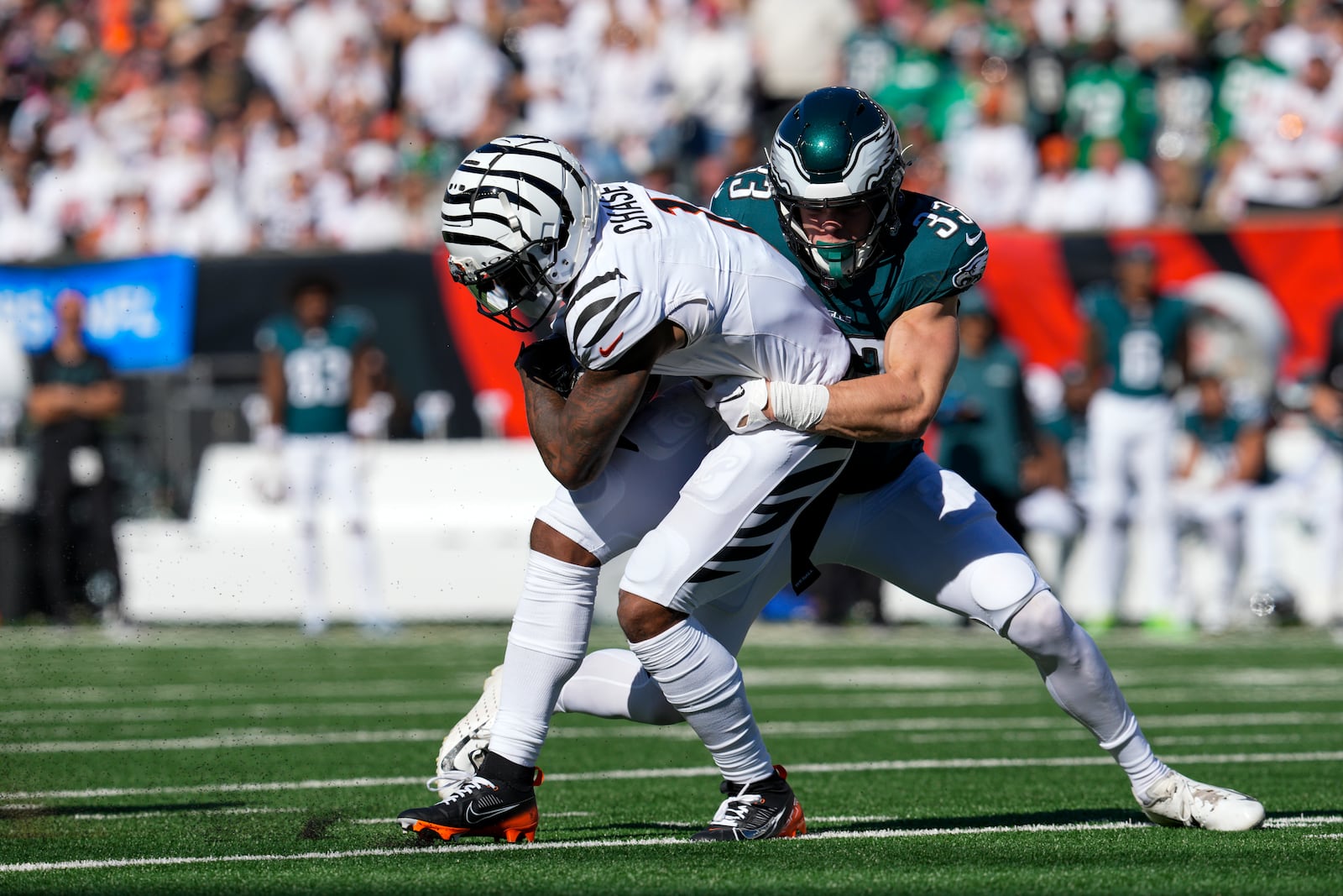 Cincinnati Bengals wide receiver Ja'Marr Chase, left, is tackled by Philadelphia Eagles cornerback Cooper DeJean during the second half of an NFL football game, Sunday, Oct. 27, 2024 in Cincinnati. (AP Photo/Jeff Dean)