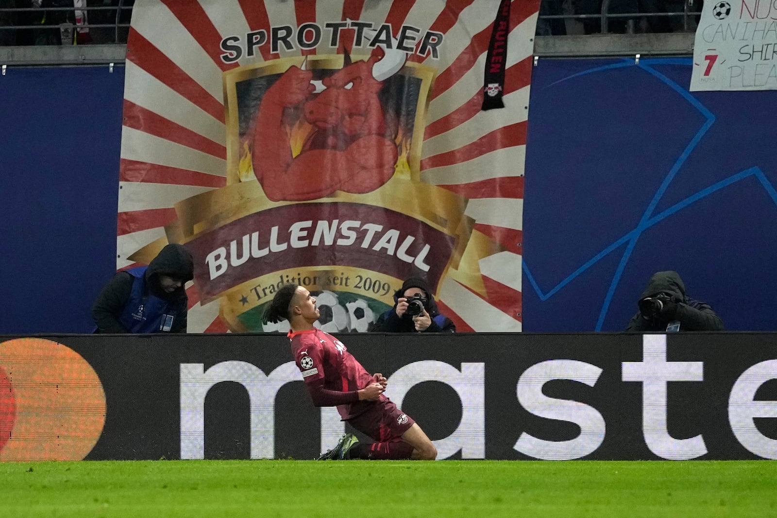 Leipzig's Yussuf Poulsen celebrates after scoring his side's second goal during the Champions League soccer match between RB Leipzig and Sporting CP at the RB Arena in Leipzig, Germany, Wednesday, Jan. 22, 2025. (AP Photo/Matthias Schrader)