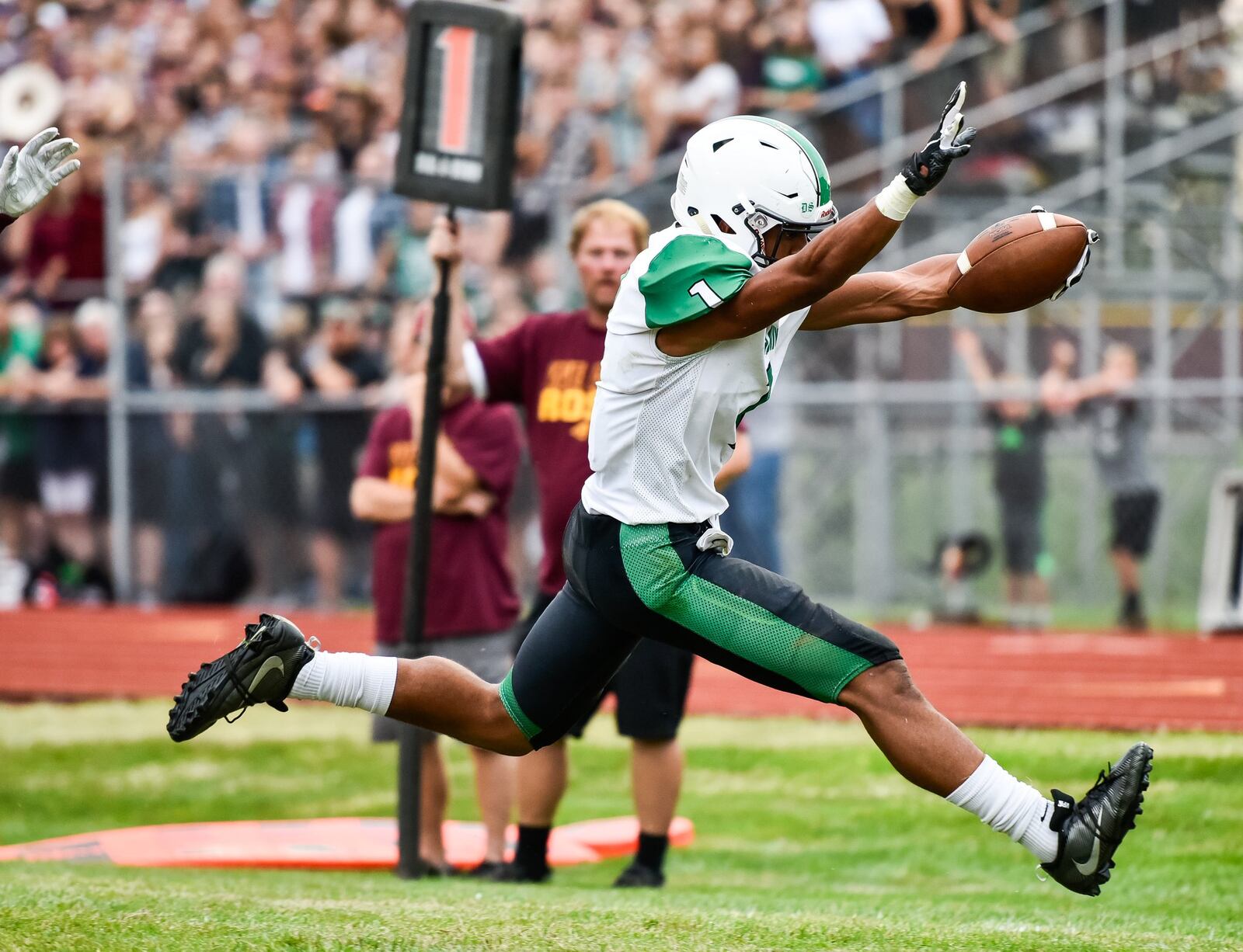 Badin’s Davon Starks heads into the end zone for one of his three touchdowns during Friday night’s game against Ross at Robinson Field in Ross Township. NICK GRAHAM/STAFF