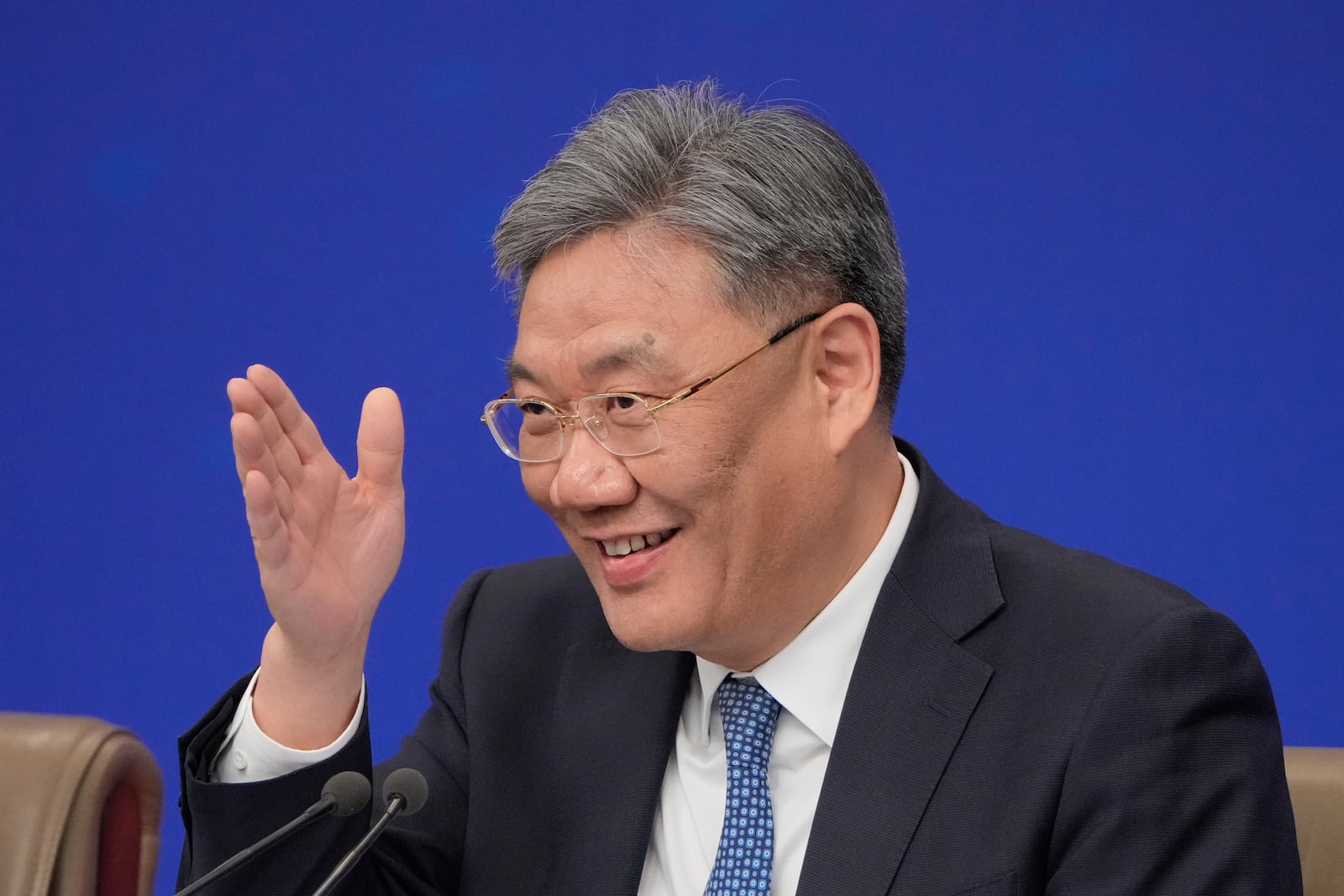 Wang Wentao, Commerce Minister speaks during a press conference on the sideline of the National People's Congress in Beijing, China, Thursday, March 6, 2025. (AP Photo/Vincent Thian)