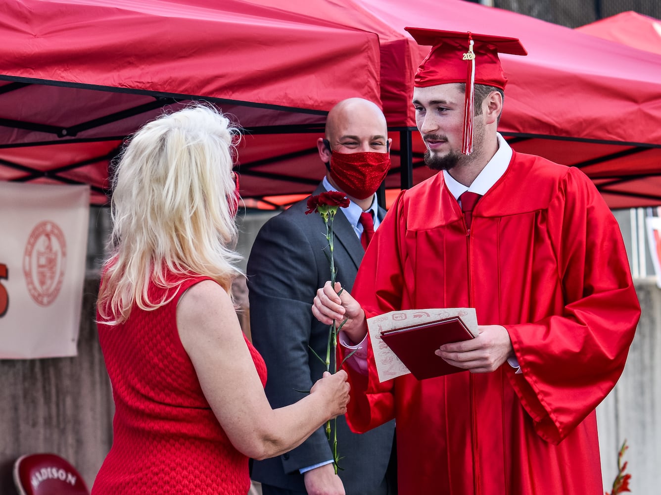 Madison High School drive-thru graduation ceremony at Land of Illusion