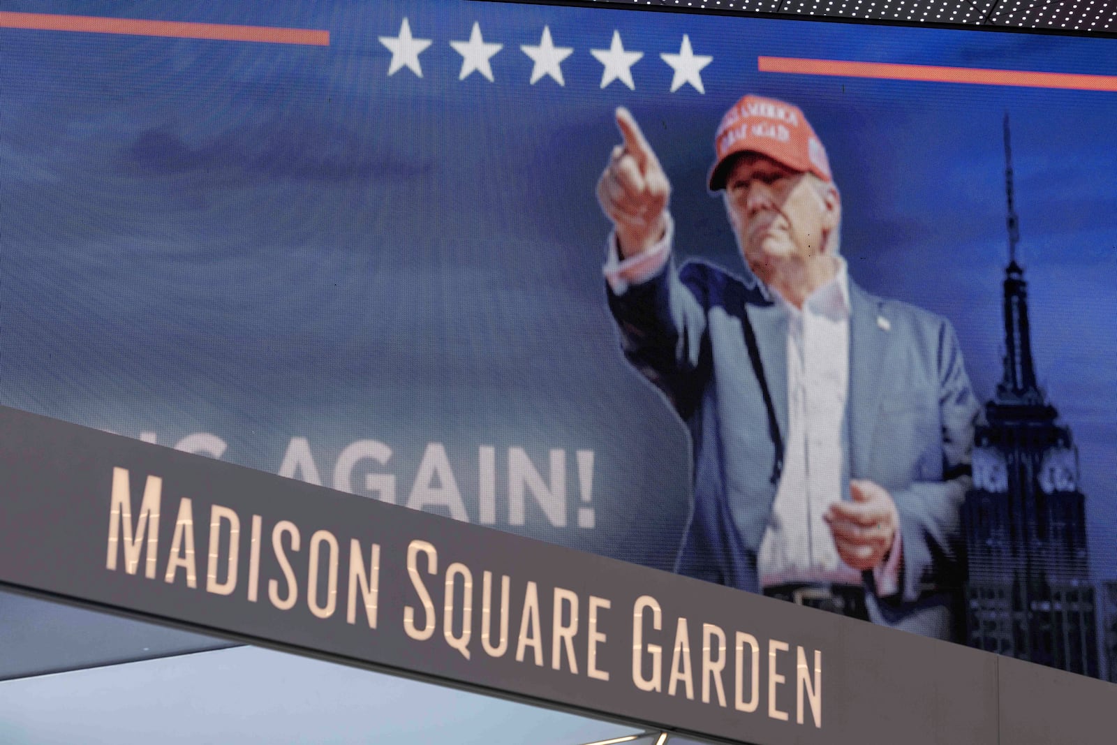 Video boards display information about the campaign rally for Republican presidential nominee former President Donald Trump outside Madison Square Garden, Sunday, Oct. 27, 2024, in New York. (AP Photo/Yuki Iwamura)