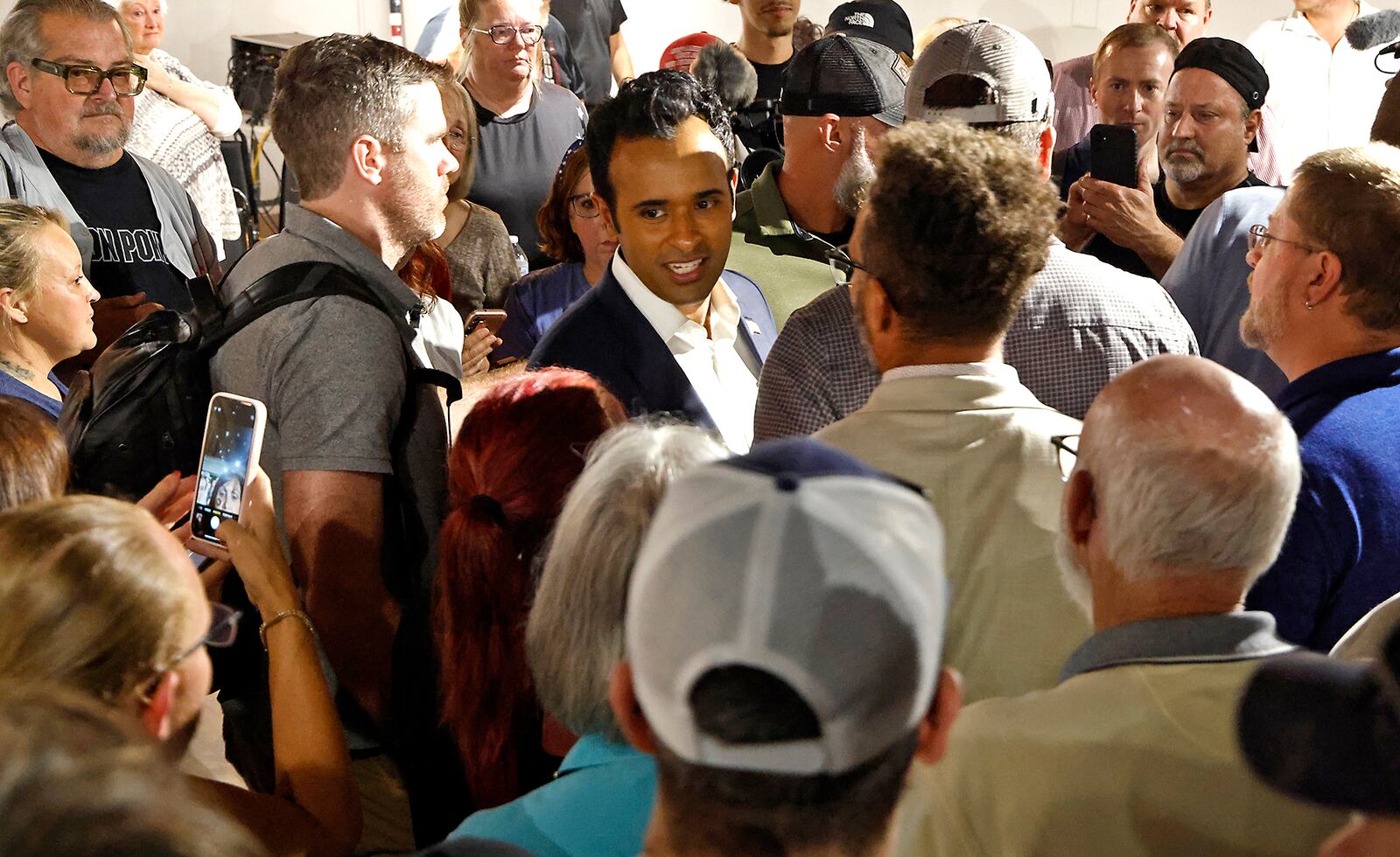 Former presidential candidate Vivek Ramaswamy is surrounded by supporters after a town hall meeting at the Bushnell Banquet Center in Springfield Thursday, Sept. 19, 2024. BILL LACKEY/STAFF