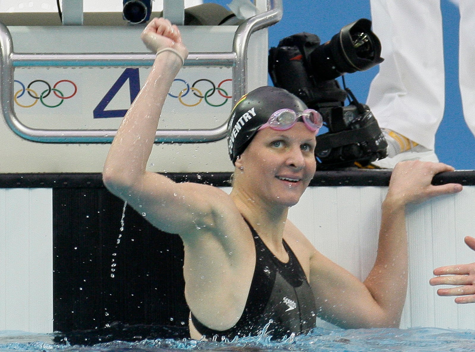 FILE - Zimbabwe's Kirsty Coventry reacts after setting a new world record in the women's 100-meter backstroke semi-finals during the swimming competitions in the National Aquatics Center at the Beijing 2008 Olympics in Beijing, Monday, Aug. 11, 2008. (AP Photo/David J. Phillip, File)