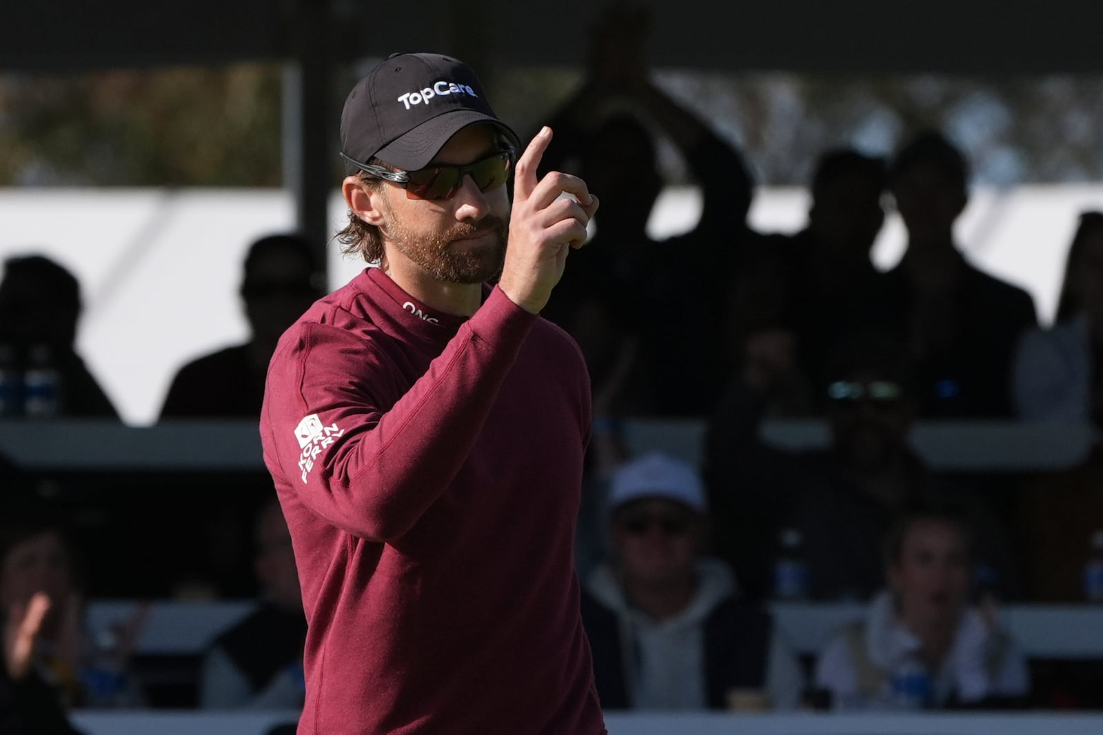 Patrick Rodgers reacts after making a birdie on the 17th hole of the South Course at Torrey Pines during the third round of the Genesis Invitational golf tournament Saturday, Feb. 15, 2025, in San Diego. (AP Photo/Gregory Bull)