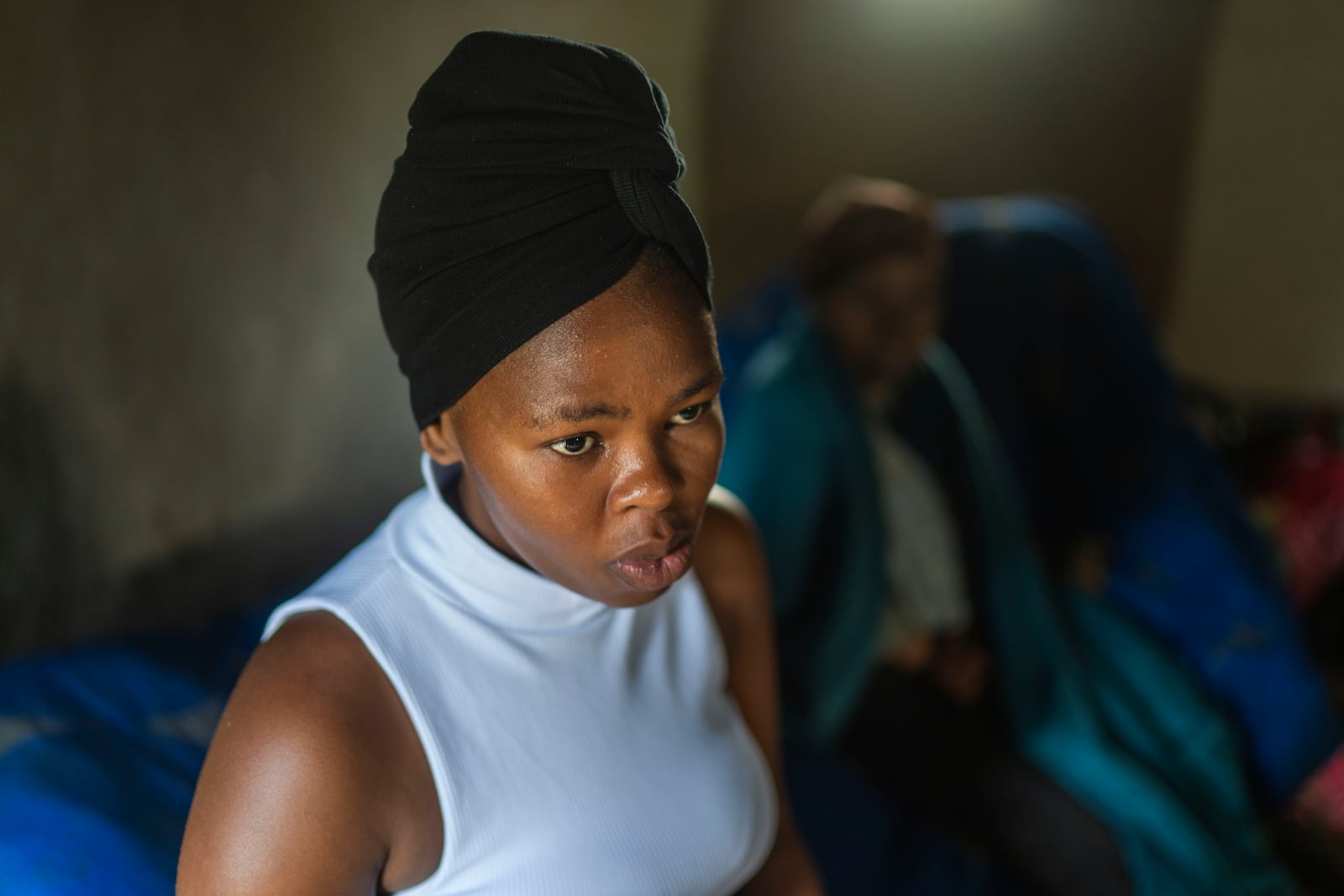 Unemployed 19-year-old South African Nozuko Majola, sitting in her Umzimkhulu home Tuesday, Nov. 11, 2025, is one of millions of patients in South Africa affected by U.S. President Donald Trump's global foreign aid freeze, raising worries about HIV patients defaulting on treatment. (AP Photo/Jerome Delay)