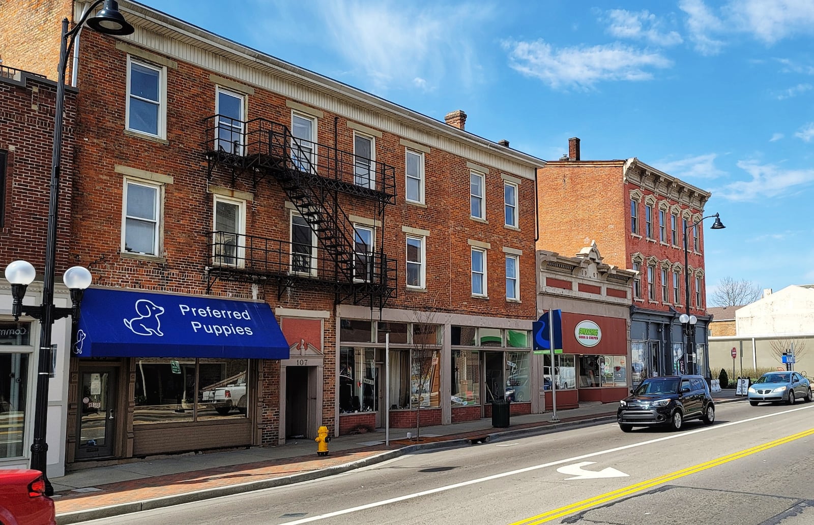 Eight upscale apartments are planned for Main Street, including at 107 Main St., the building with the Preferred Puppies shop. NICK GRAHAM/STAFF